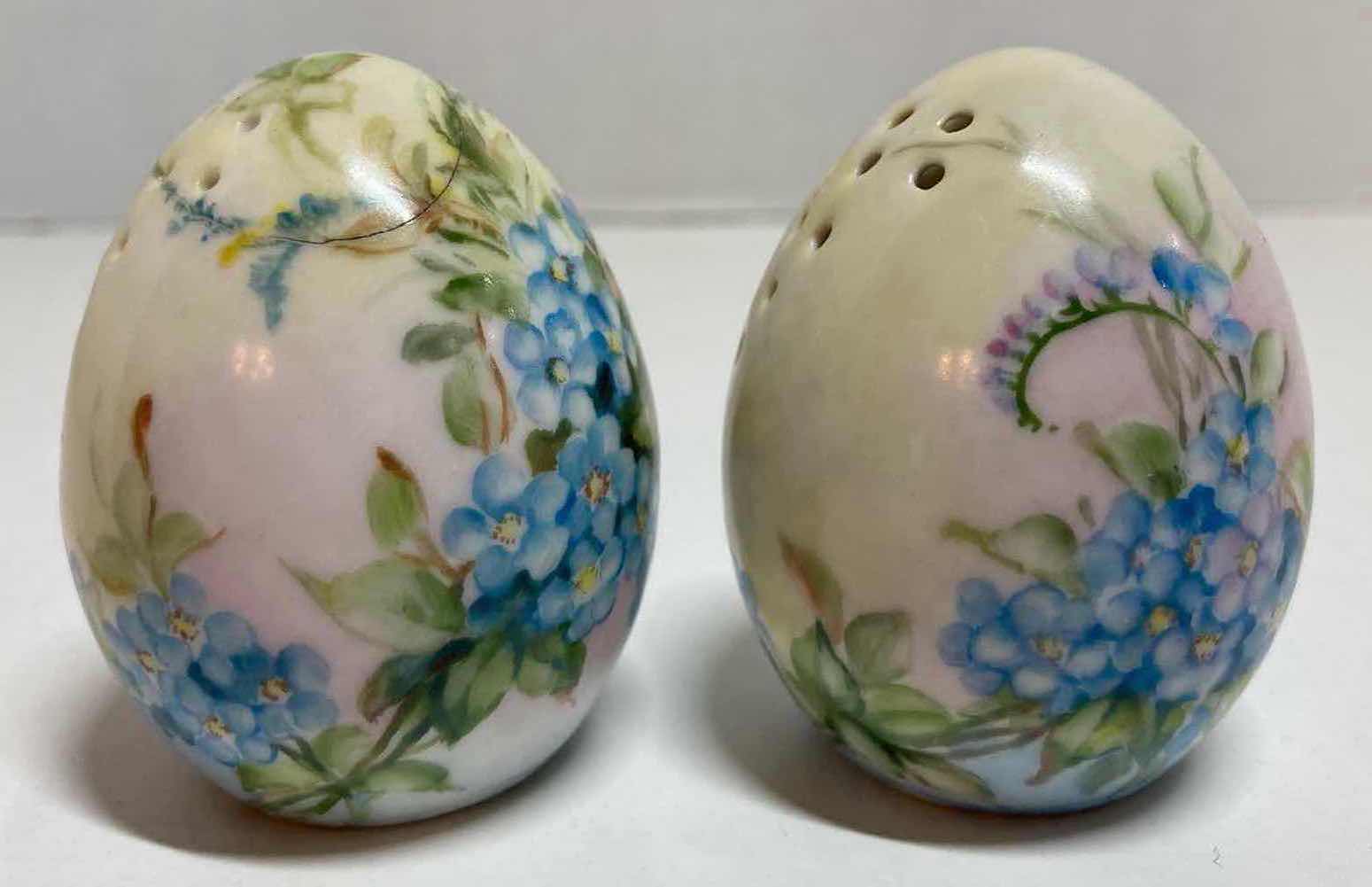 Photo 1 of GERMAN HAND PAINTED BLUE FLORAL PORCELAIN EGG-SHAPED SALT AND PEPPER SHAKER H2.5”