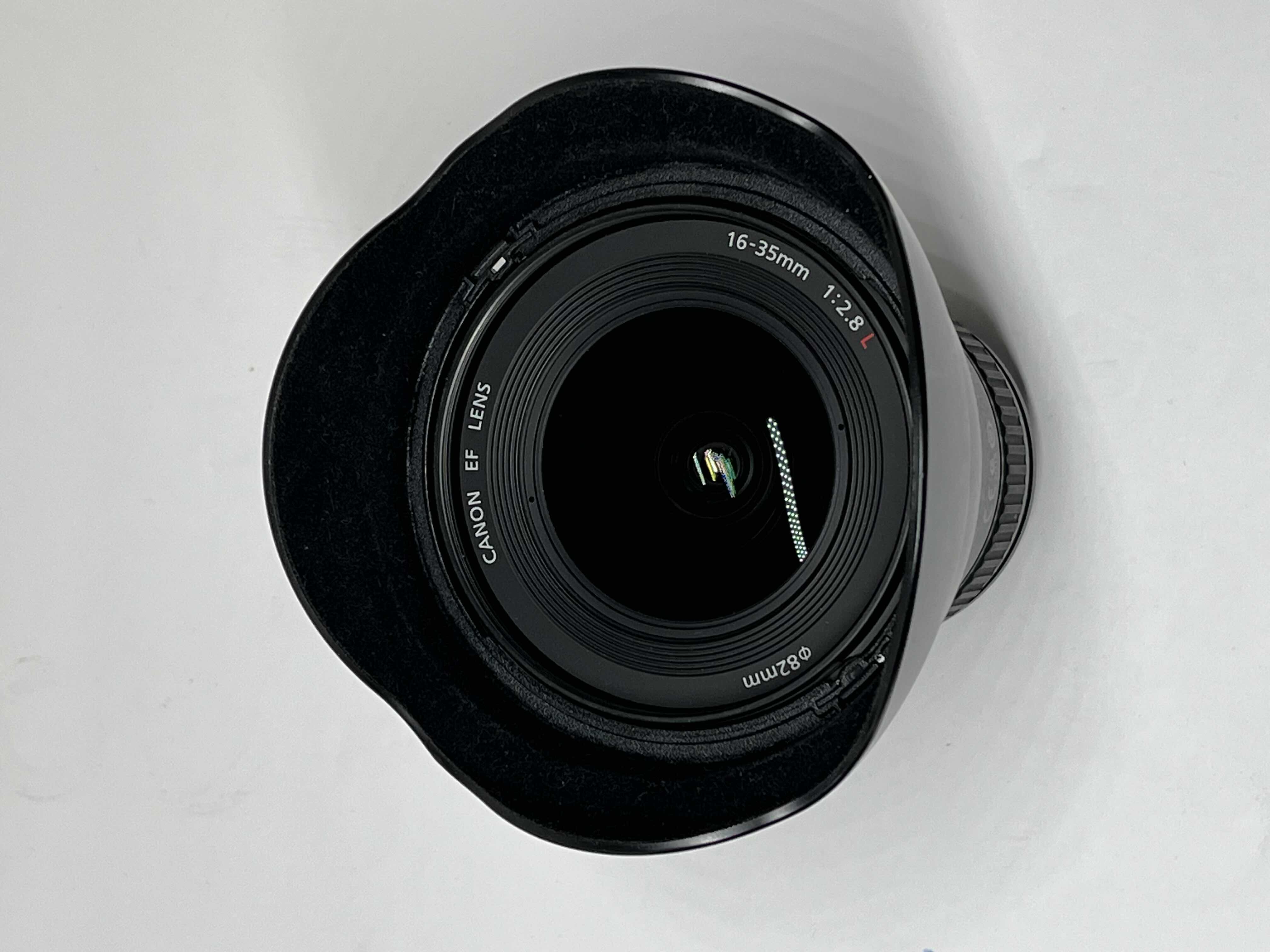 Photo 1 of CANON ULTRASONIC HSM EF 16-35MM F/2.8L II CAMERA LENS W CANON LENS HOOD MODEL EW-88