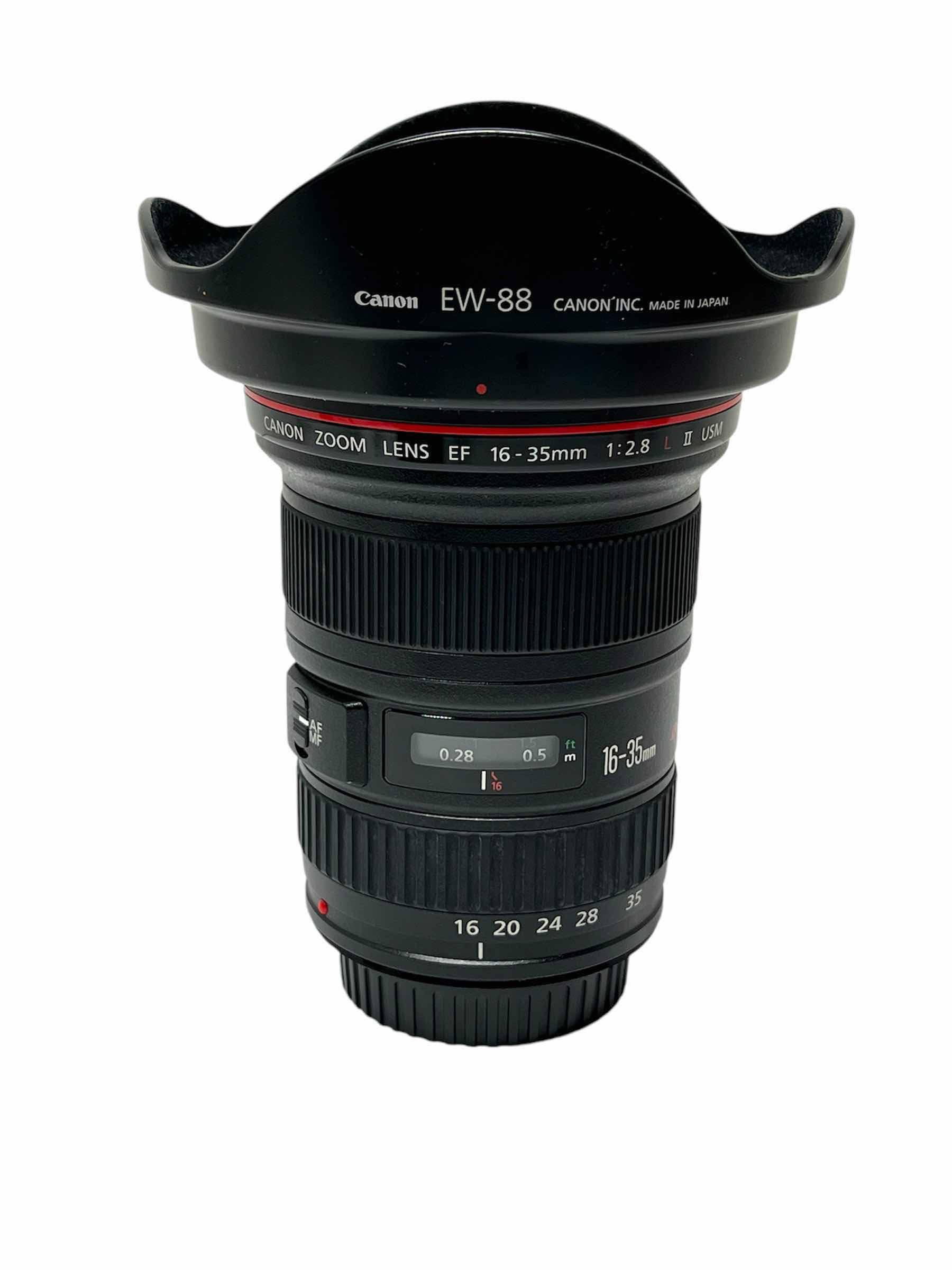 Photo 1 of CANON ULTRASONIC HSM EF 16-35MM F/2.8L II CAMERA LENS W CANON LENS HOOD MODEL EW-88