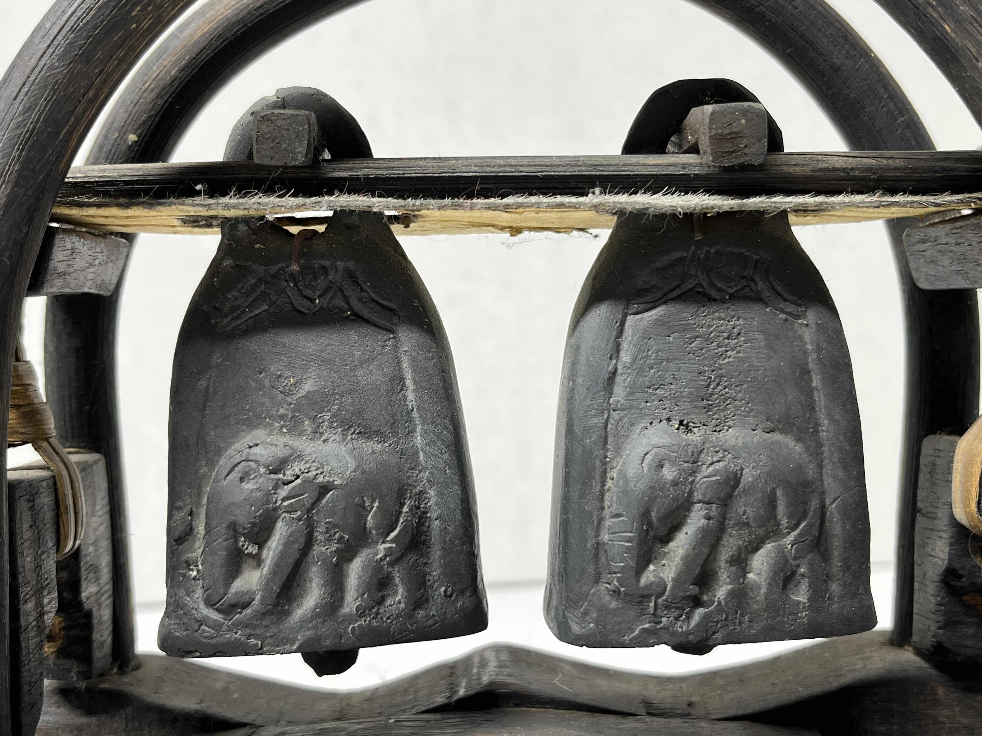 Photo 1 of KAREN HILL TRIBE THAILAND ANTIQUE HAND CARVED WOOD STAND W DOUBLE ELEPHANT BRONZE BELLS 8” X 3” H7.5”