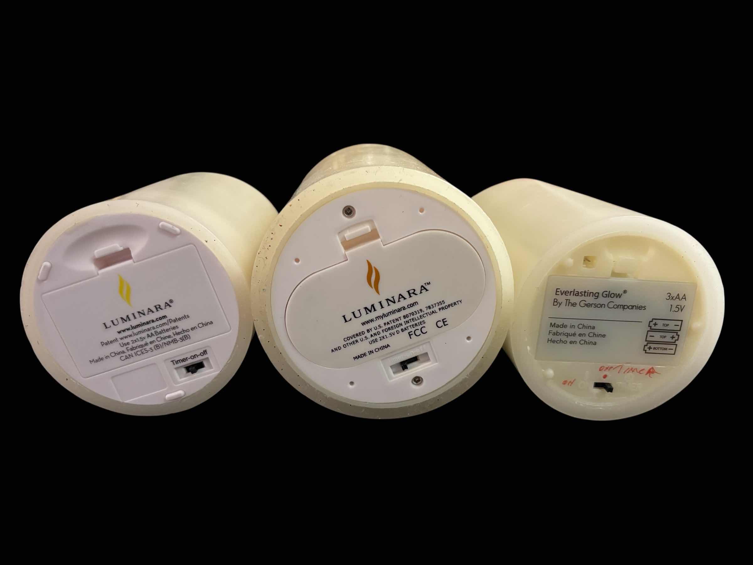 Photo 1 of FLICKERING FLAMELESS LED CANDLES W TIMER SETTING, SET OF 3, IVORY COLOR W MELTED TOP (4.75”, 5.75” & 6”)