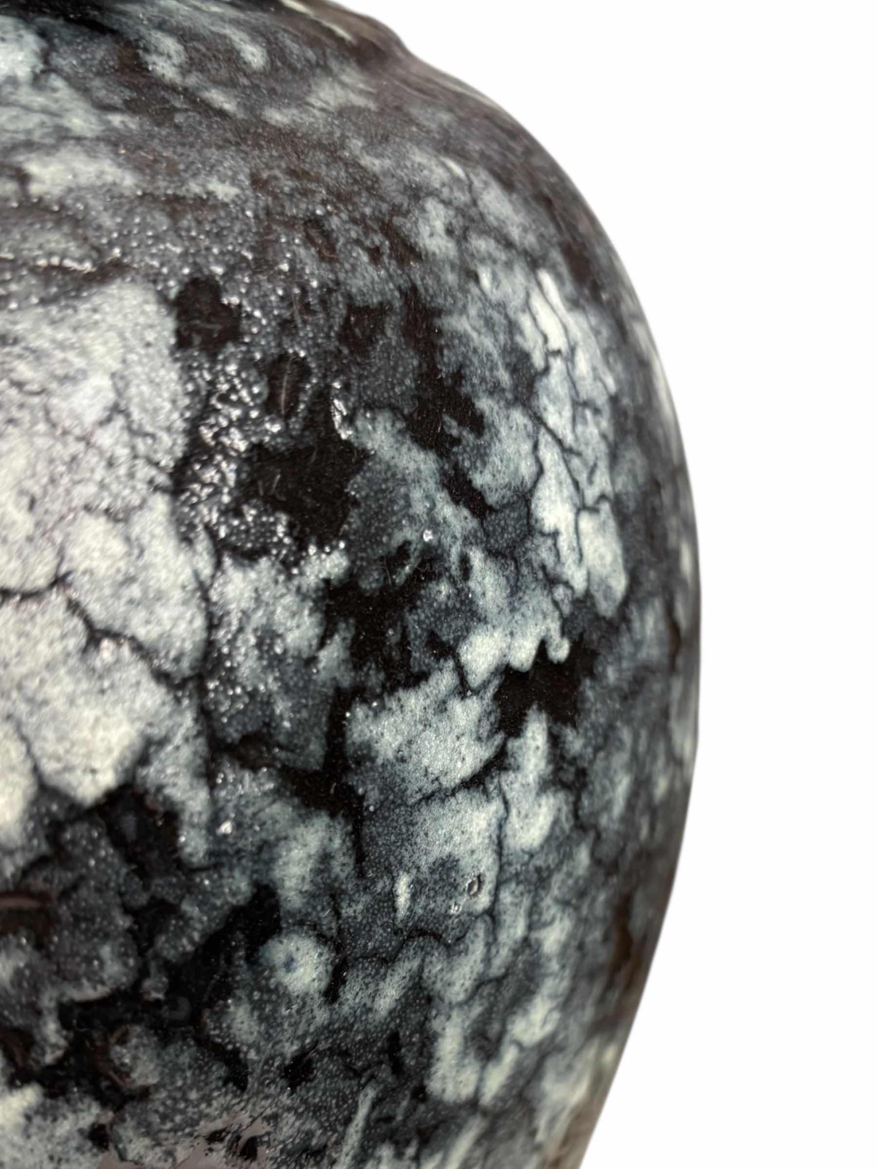 Photo 1 of DECORATIVE BLACK/WHITE TEXTURED VASE 11”D X H16”