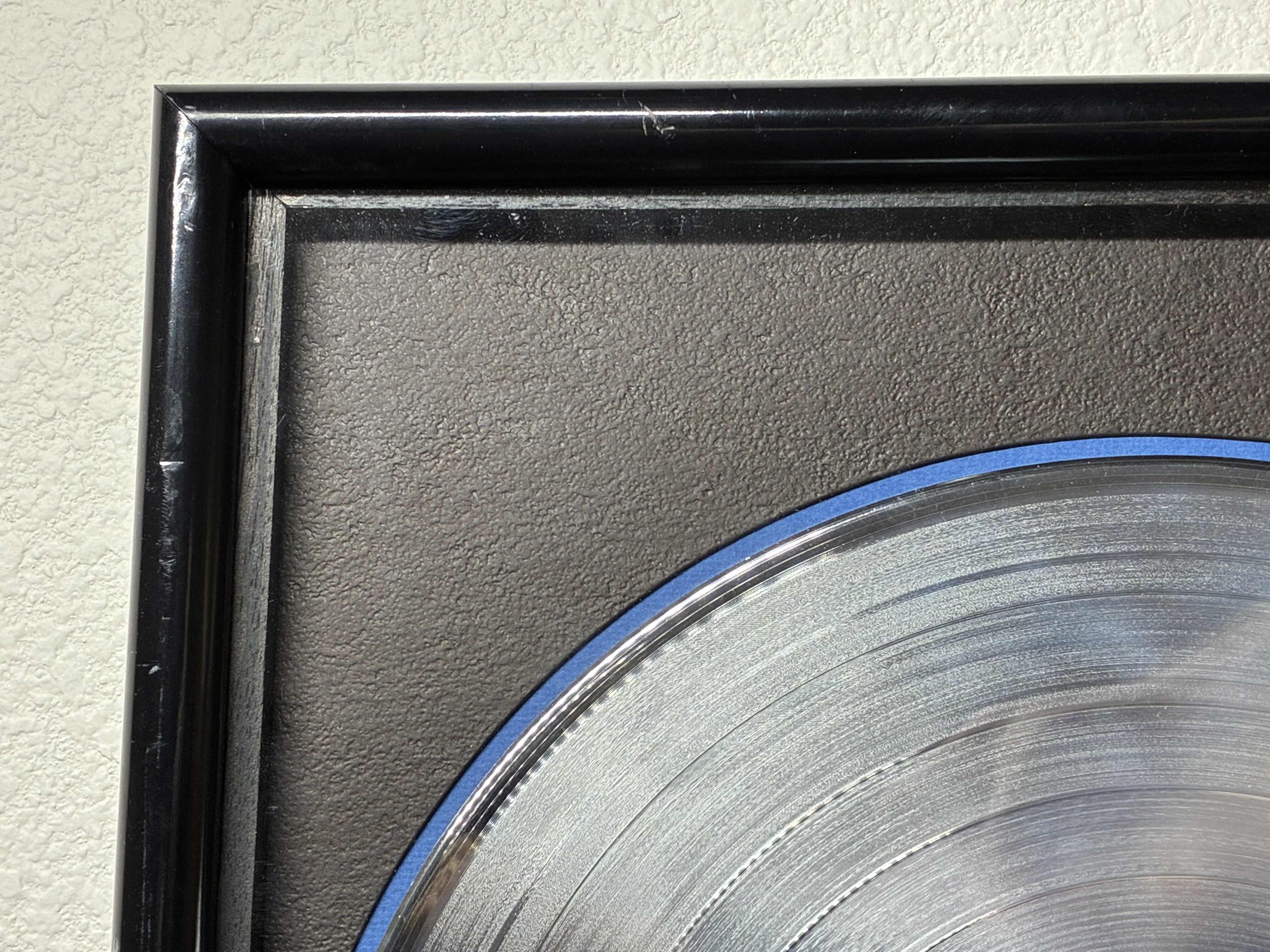 Photo 1 of PLATINUM RECORD PRESENTED TO MARC KORDELOS TO COMMEMORATE THE SALE OF MORE THAN $1M COPIES OF THE COLUMBIA RECORDS ALBUM, CASSETTE & CD
"GONNA MAKE YOU SWEAT" FRAMED PLAQUE 17“ X 21“