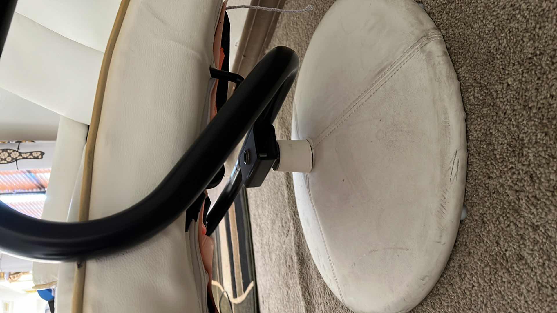 Photo 1 of WHITE LEATHER SWIVEL CHAIR W OTTOMAN