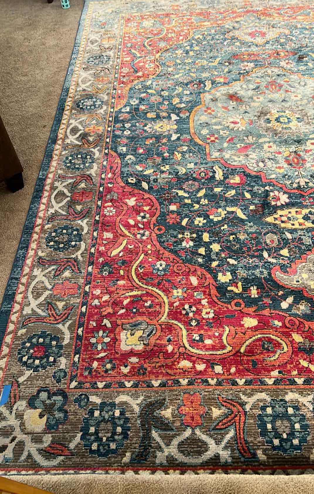 Photo 1 of 8’ x 12’ BLUE/RUST/CREAM MULTI-COLORED PATTERNED RUG.