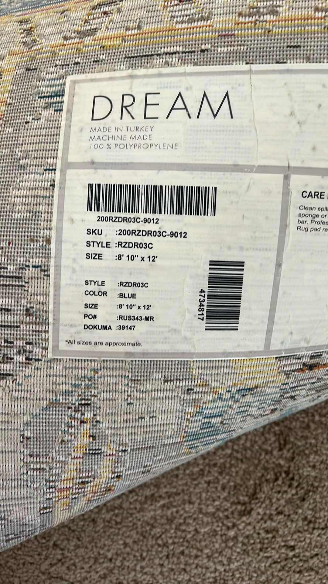 Photo 1 of 8’ x 12’ BLUE/RUST/CREAM MULTI-COLORED PATTERNED RUG.