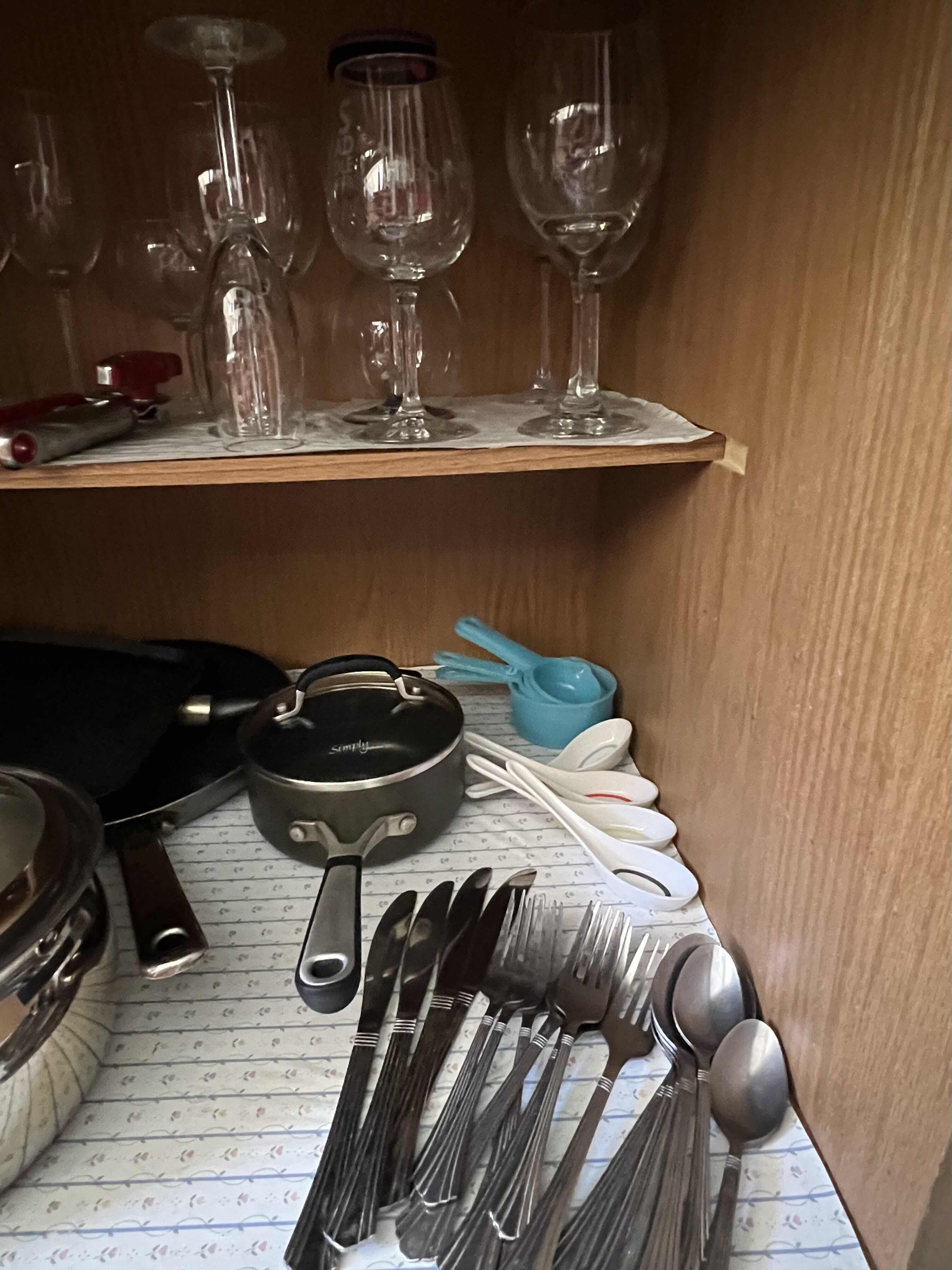 Photo 1 of CONTENTS OF KITCHEN CABINET (KITCHEN COOKWARE, FLATWARE & STEMWARE)