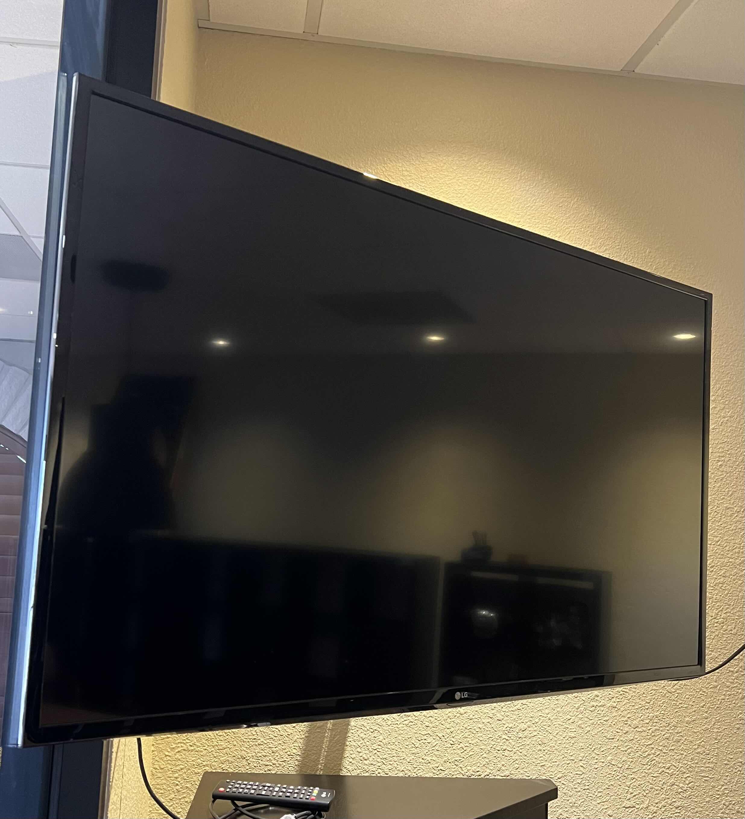 Photo 1 of 48” LG FLATSCREEN TV WITH WALL MOUNT. W/REMOTE. 4K UHD