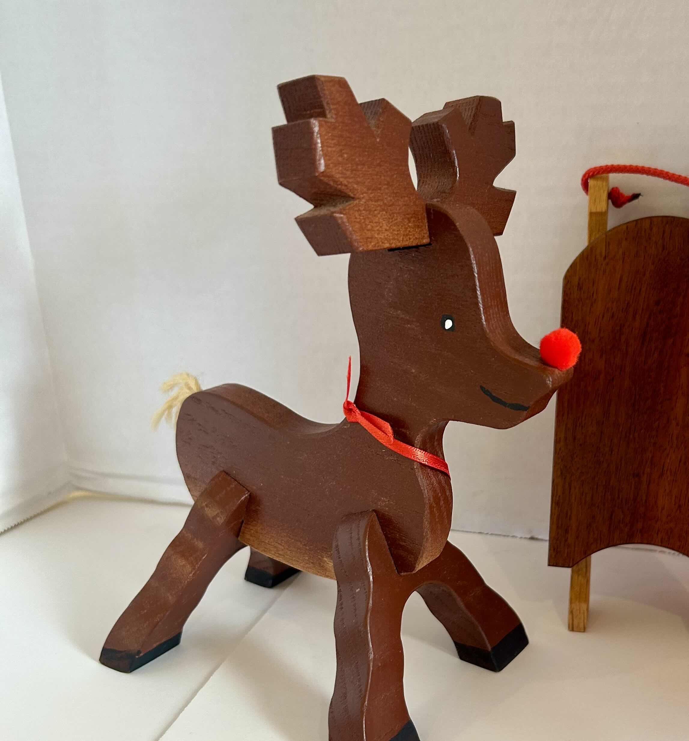 Photo 1 of 3 ITEMS OF CHRISTMAS DECOR (1) WOOD SLED, (1) WOOD REINDEER (1) FLEXIBLE ELF
