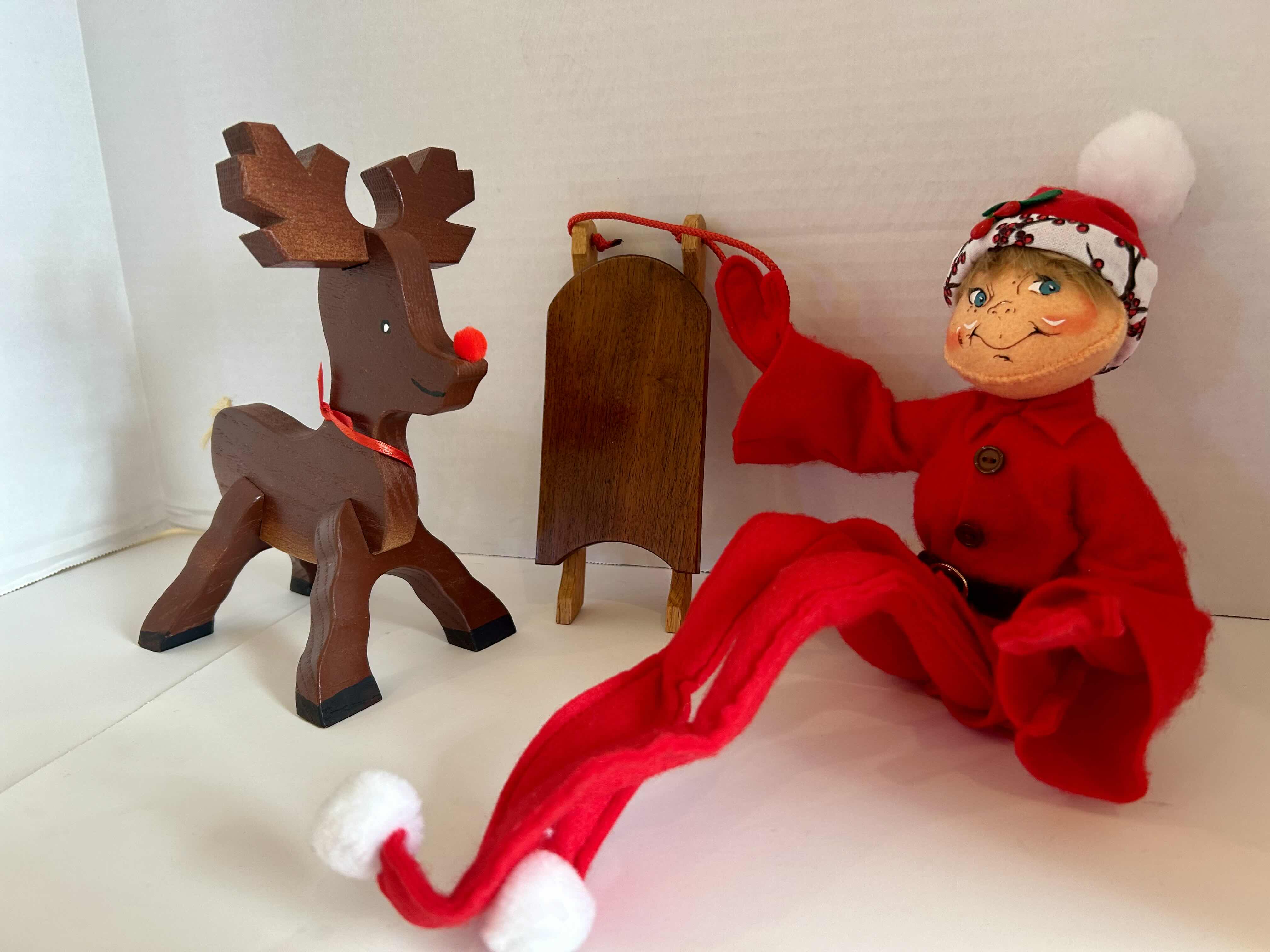 Photo 1 of 3 ITEMS OF CHRISTMAS DECOR (1) WOOD SLED, (1) WOOD REINDEER (1) FLEXIBLE ELF