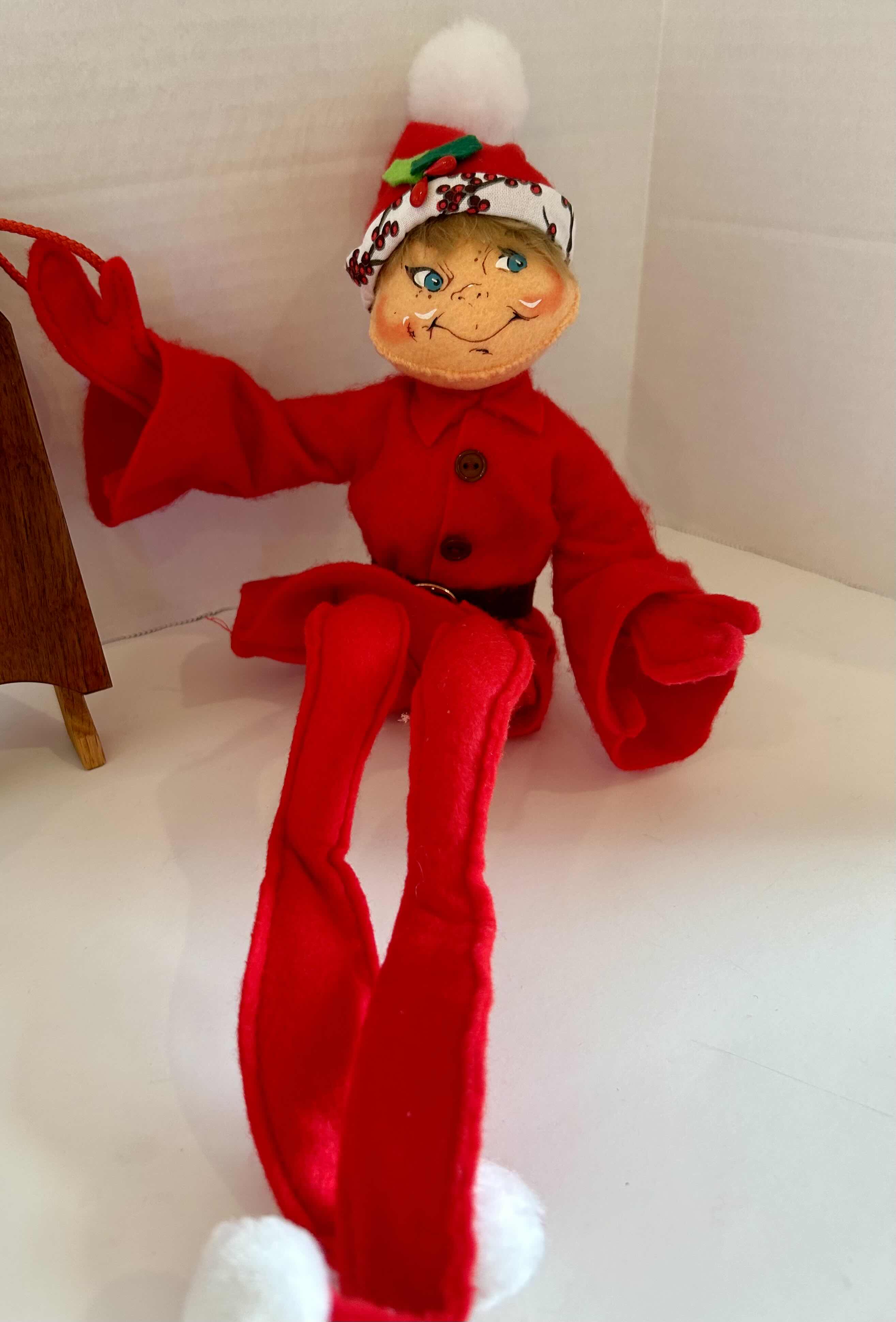 Photo 1 of 3 ITEMS OF CHRISTMAS DECOR (1) WOOD SLED, (1) WOOD REINDEER (1) FLEXIBLE ELF