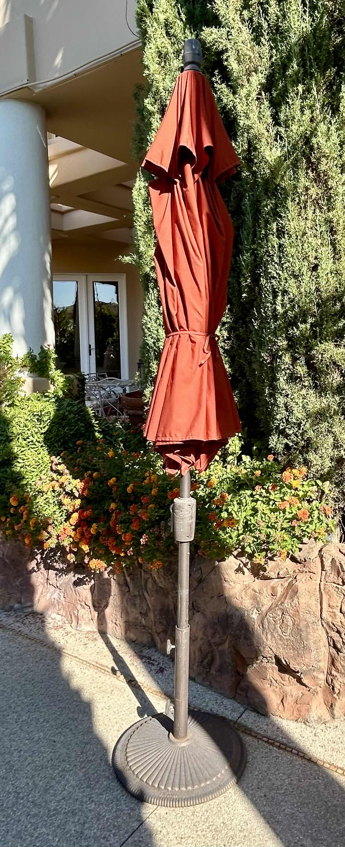 Photo 1 of 9’ SIENNA COLORED PATIO UMBRELLA WITH METAL BASE