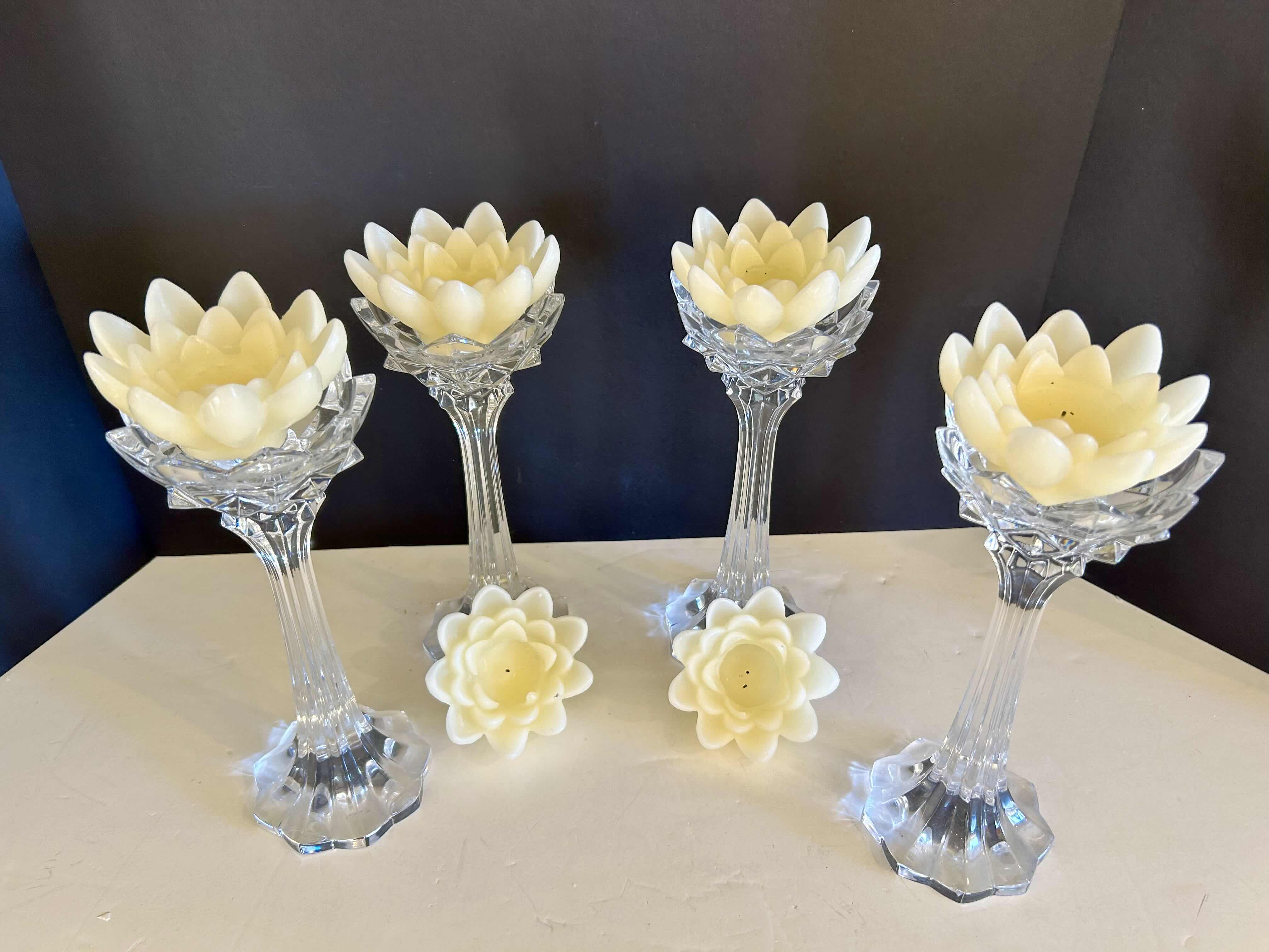 Photo 1 of (4) 10”H CRYSTAL VOTIVE HOLDERS WITH FLOWER SHAPED VOTIVE CANDLES