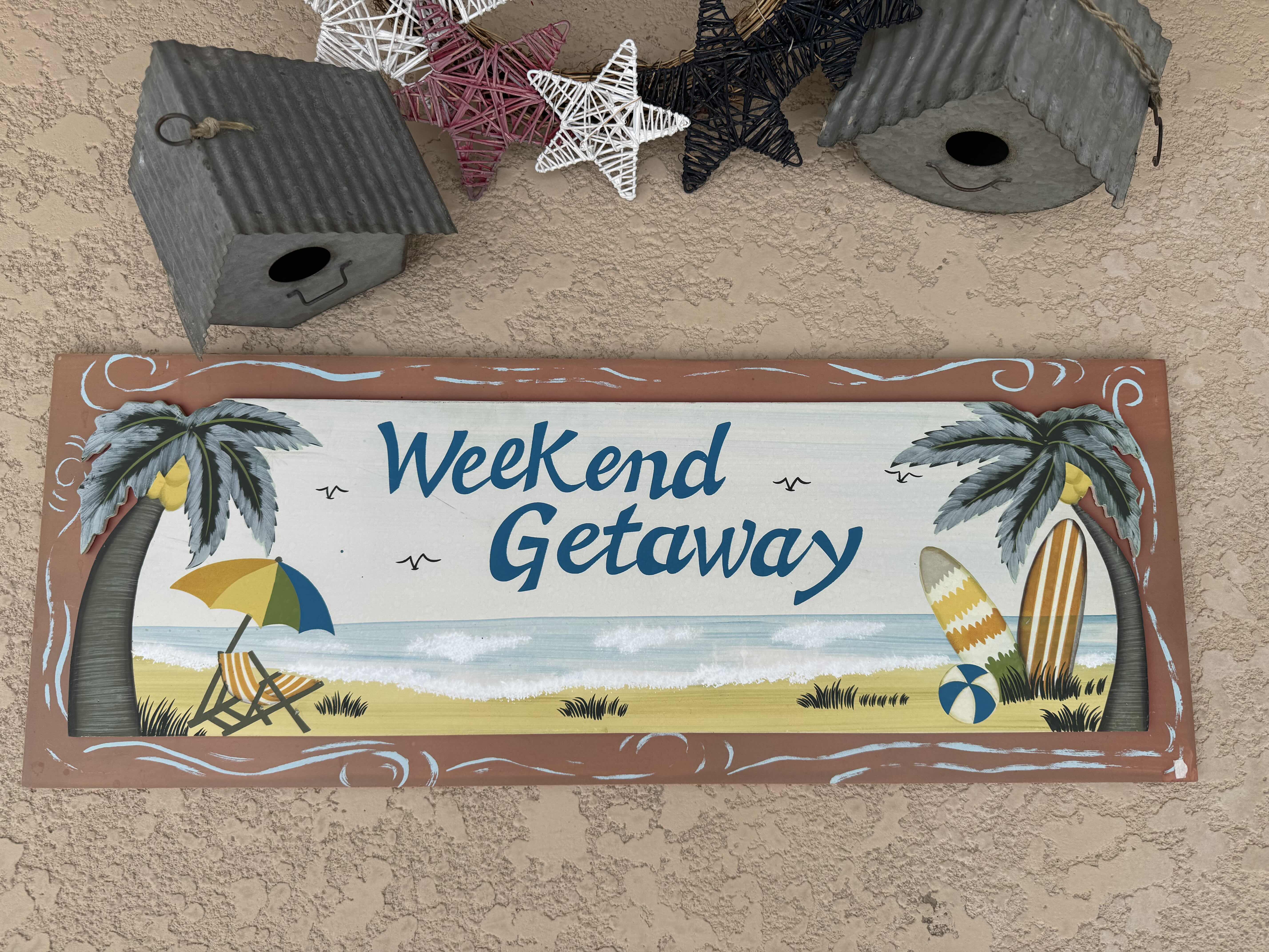 Photo 2 of 4- OUTDOOR ESSENTIALS, SIGN IS 26” X 10”