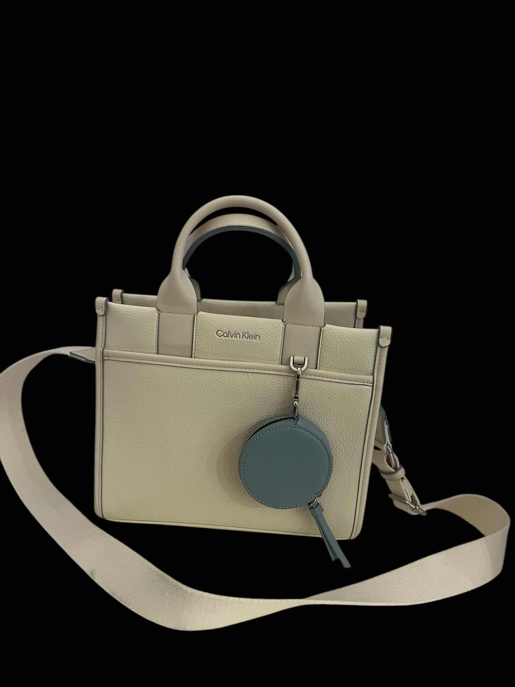 Photo 1 of CALVIN KLEIN LEATHER HAND BAG-WHITE WITH TEAL STITCHING.