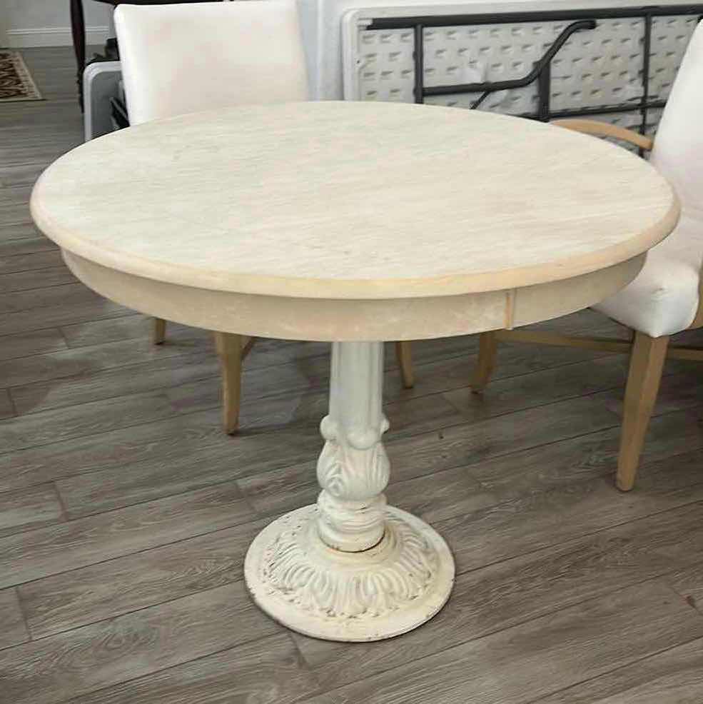 Photo 2 of WHITE ROUND TABLE. WITH WHITE METAL BASE, AND WOODEN TOP.