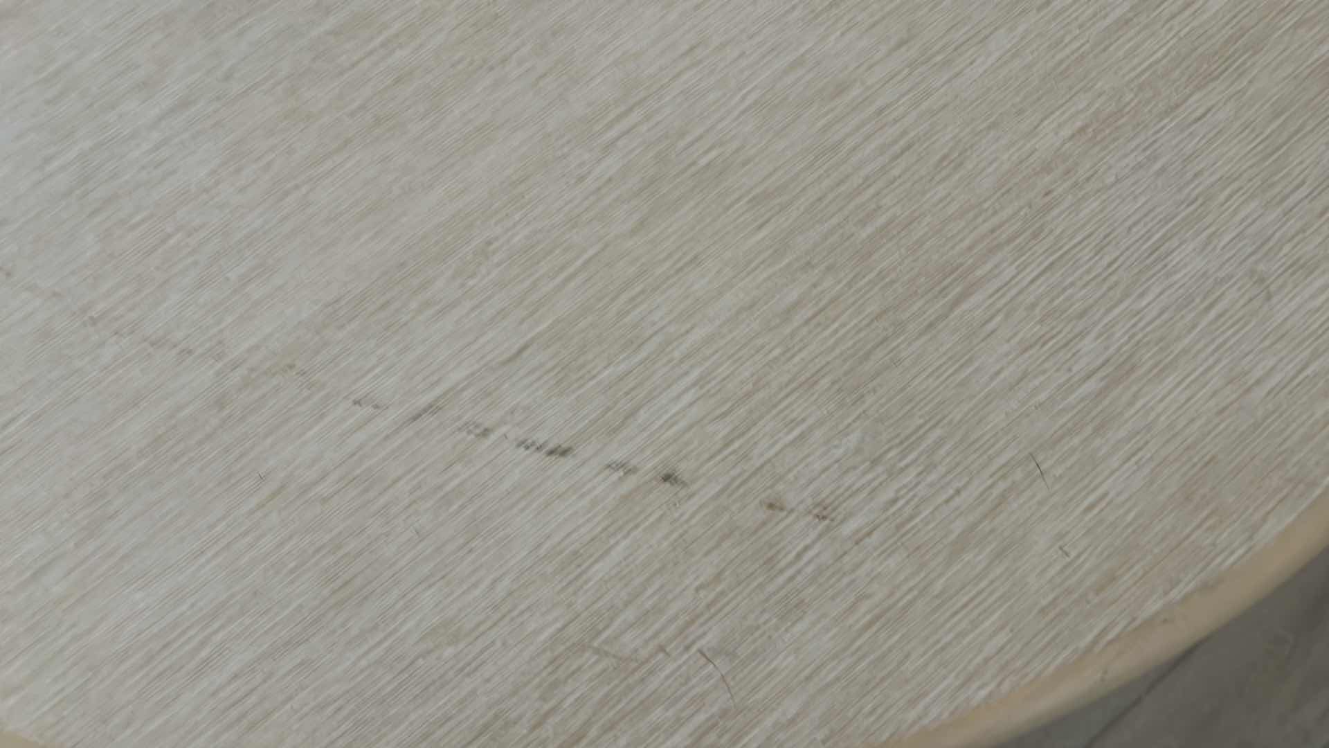 Photo 3 of WHITE ROUND TABLE. WITH WHITE METAL BASE, AND WOODEN TOP.