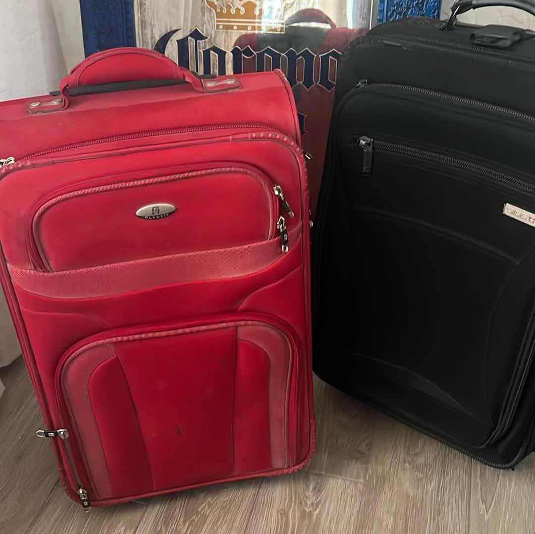 Photo 1 of 2 CARR-ON ROLLER SUITCASES-OLIMPIA AND SIGG