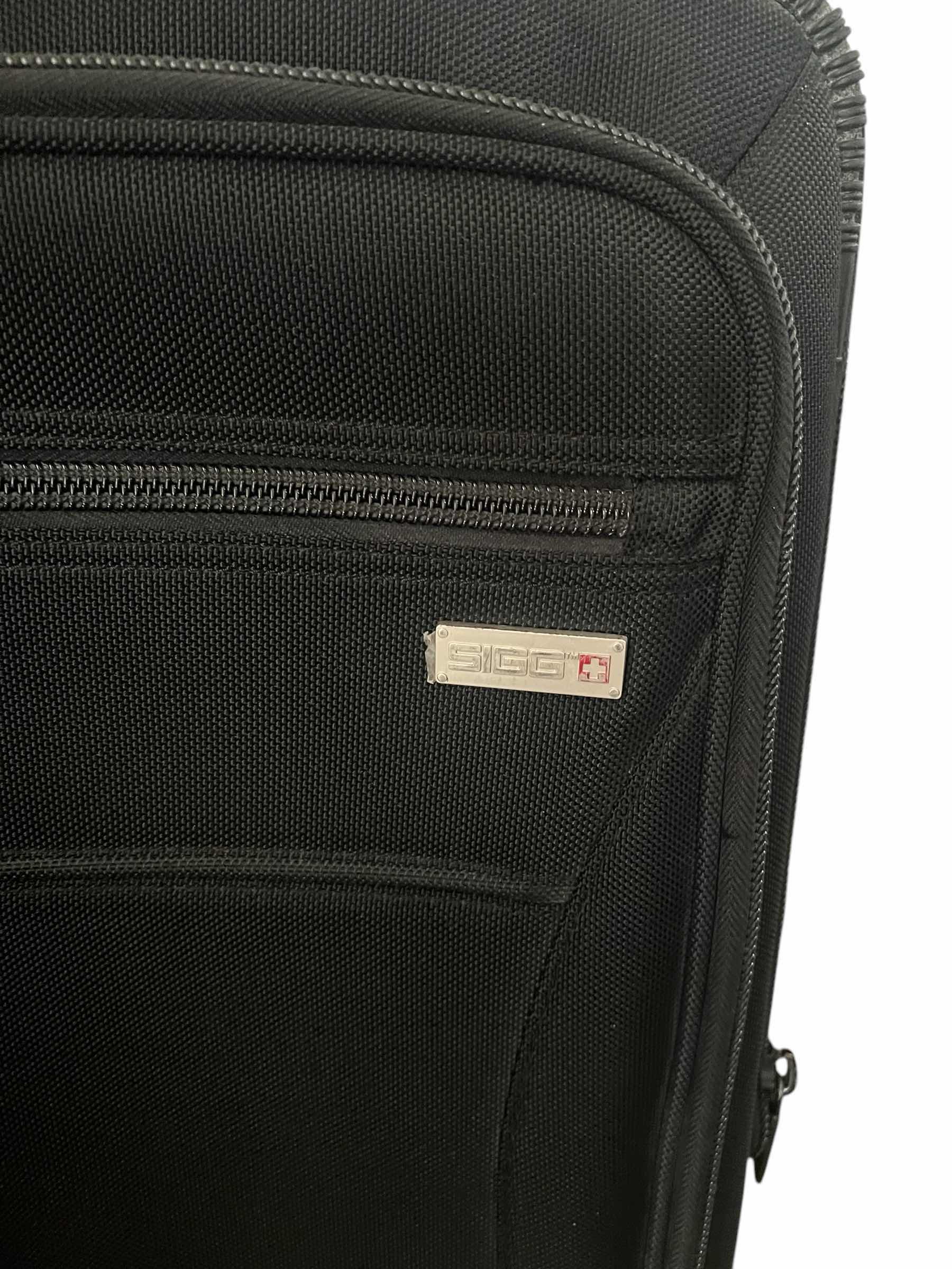 Photo 1 of 2 CARR-ON ROLLER SUITCASES-OLIMPIA AND SIGG