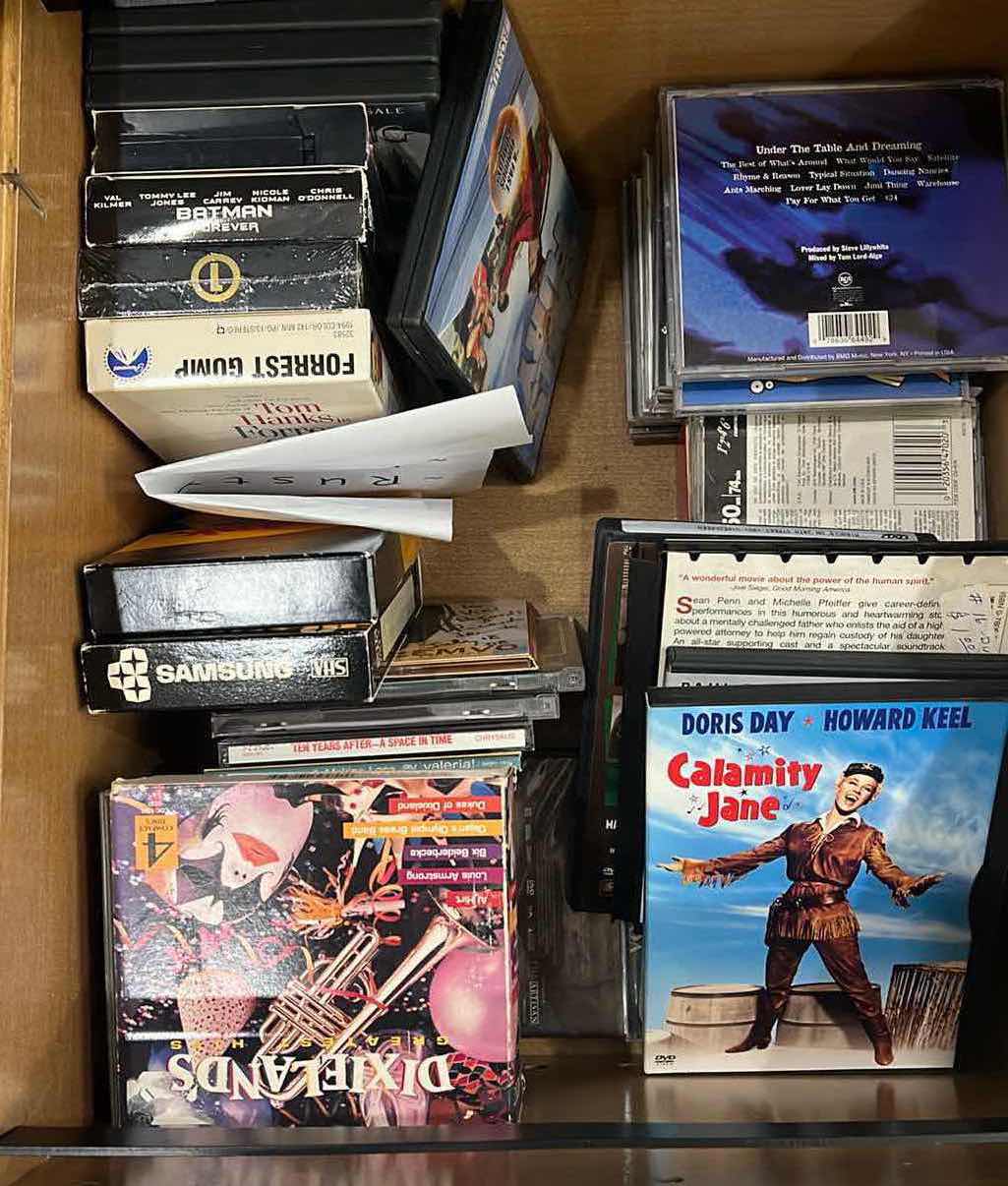 Photo 1 of CONTENTS OF OFFICE DRAWER. CDS DVD’ AND MISC ITEMS.