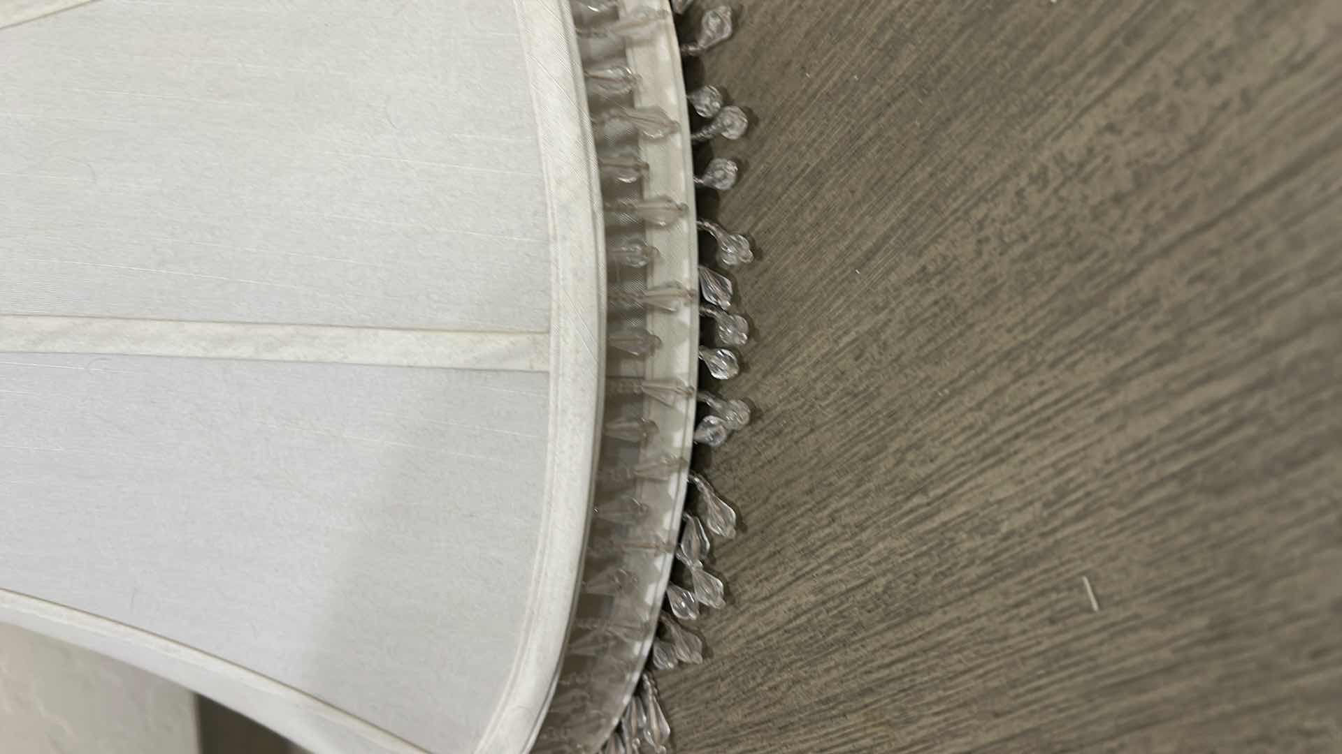 Photo 1 of 2-OFF WHITE LAMPSHADES WITH BEADED HANGING TASSELS.