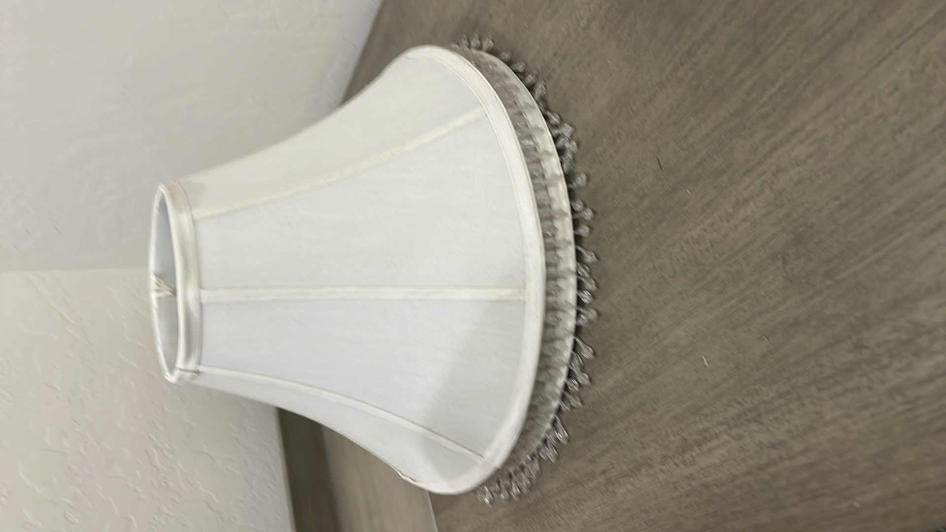 Photo 1 of 2-OFF WHITE LAMPSHADES WITH BEADED HANGING TASSELS.