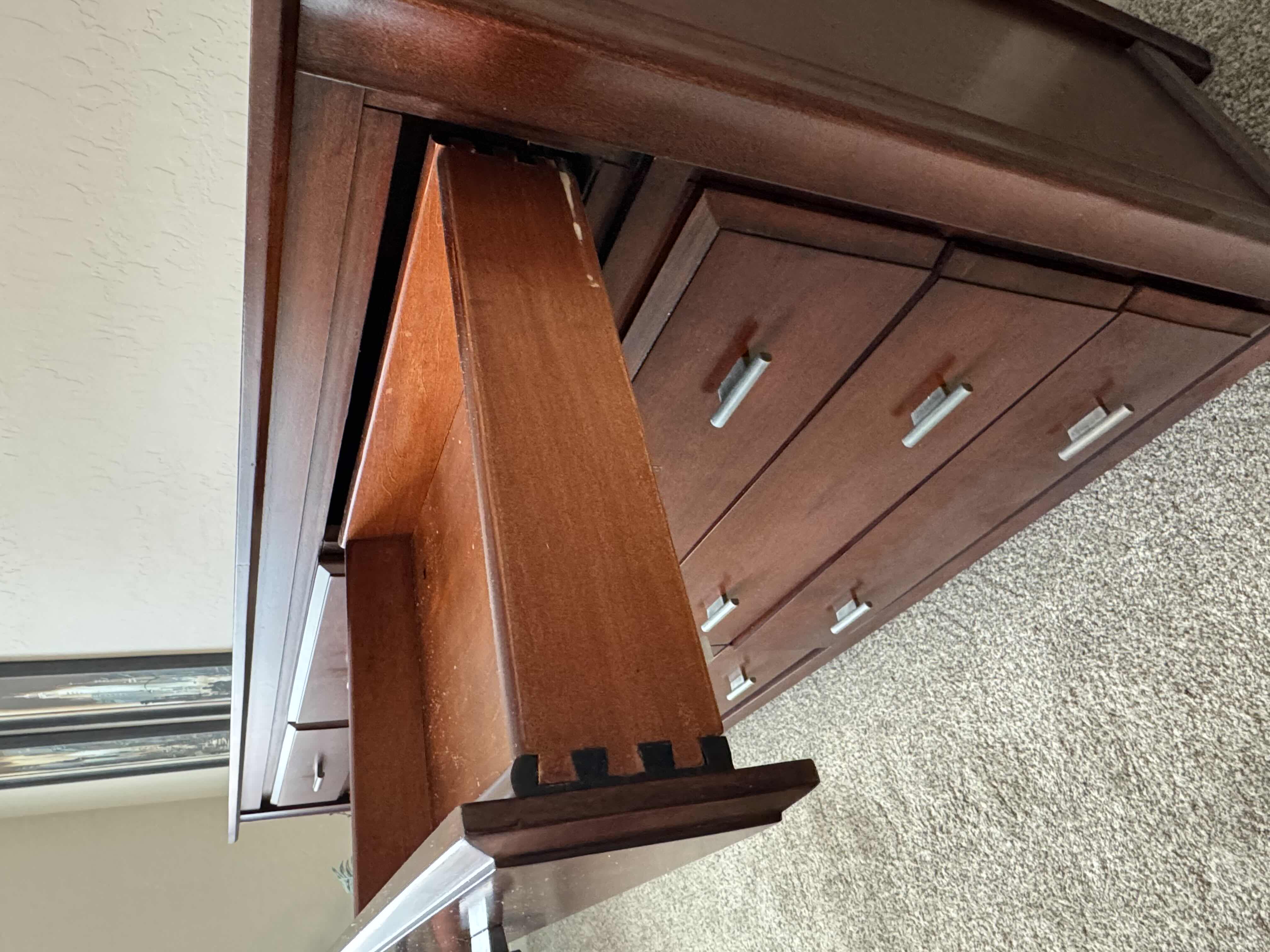 Photo 1 of FURNITURE- 9 DRAWER DRESSER-CHERRY WOOD STAINED- 64“ x 18“ H 41”. PART OF BEDROOM SET (SOLD SEPARATELY).