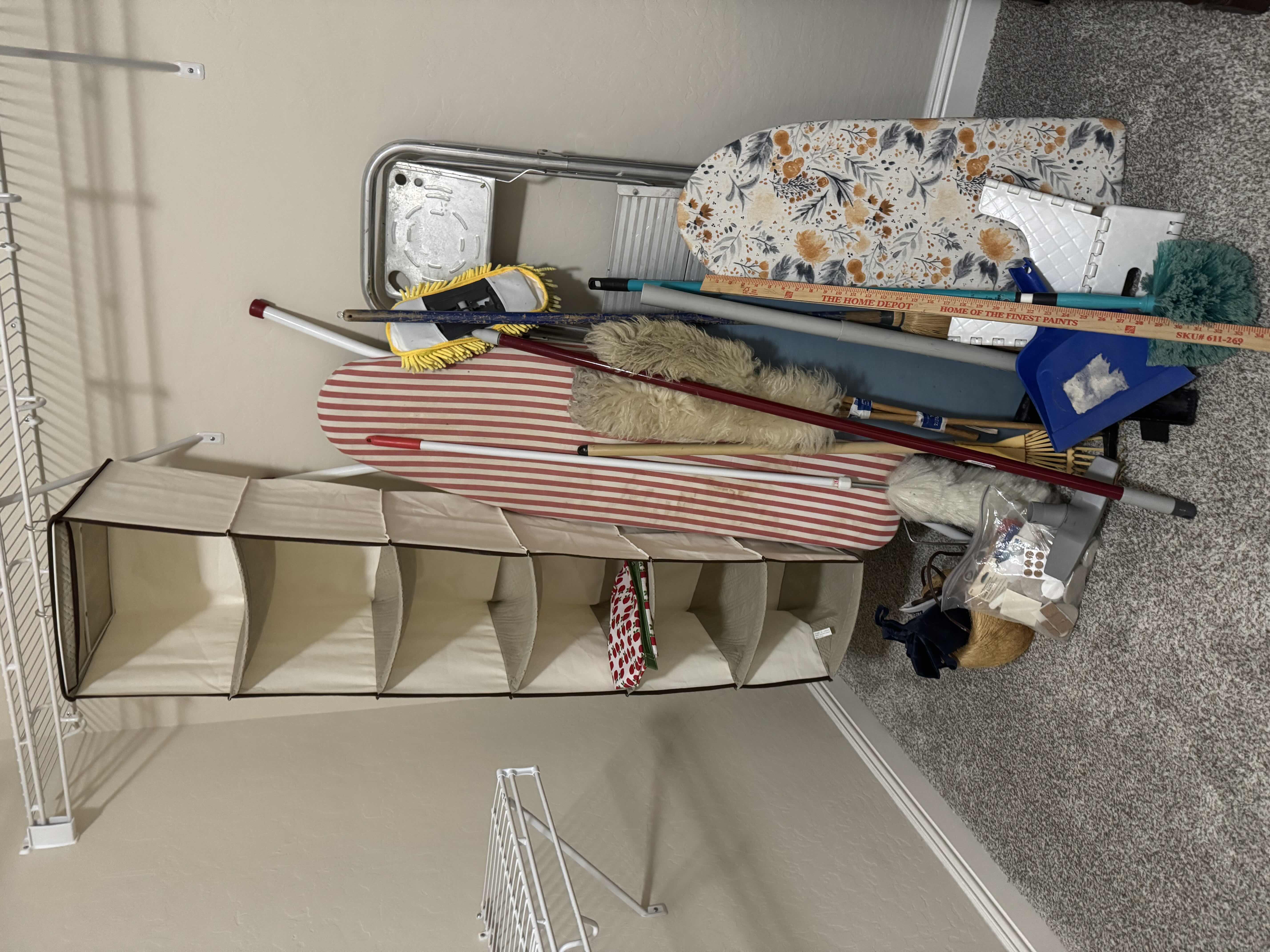 Photo 1 of CONTENTS OF CORNER: HANGING SHELF, STEP LADDER, STOOL, IRONING BOARD