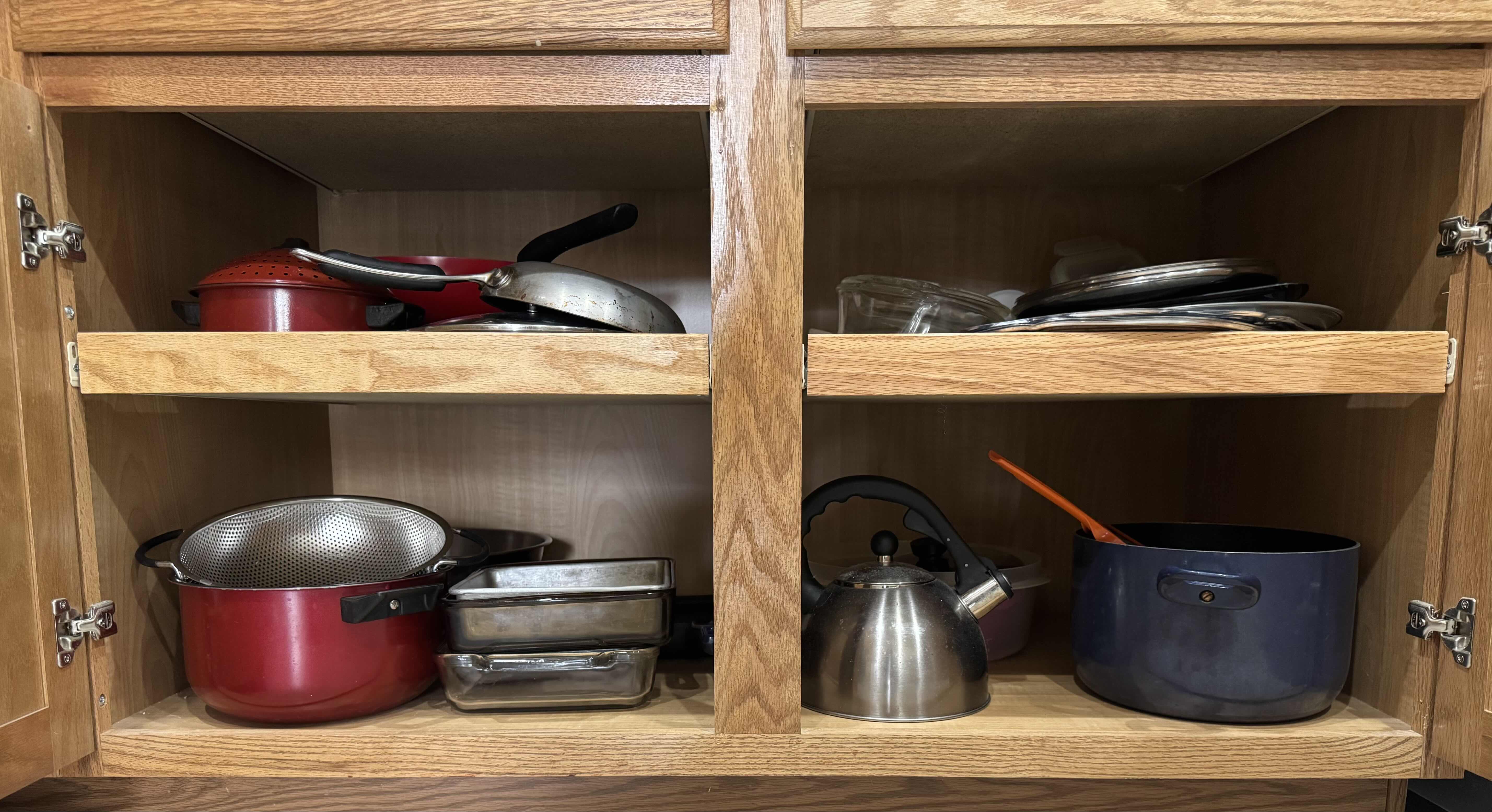 Photo 1 of CONTENTS OF KITCHEN CABINET, POTS AND PANS.