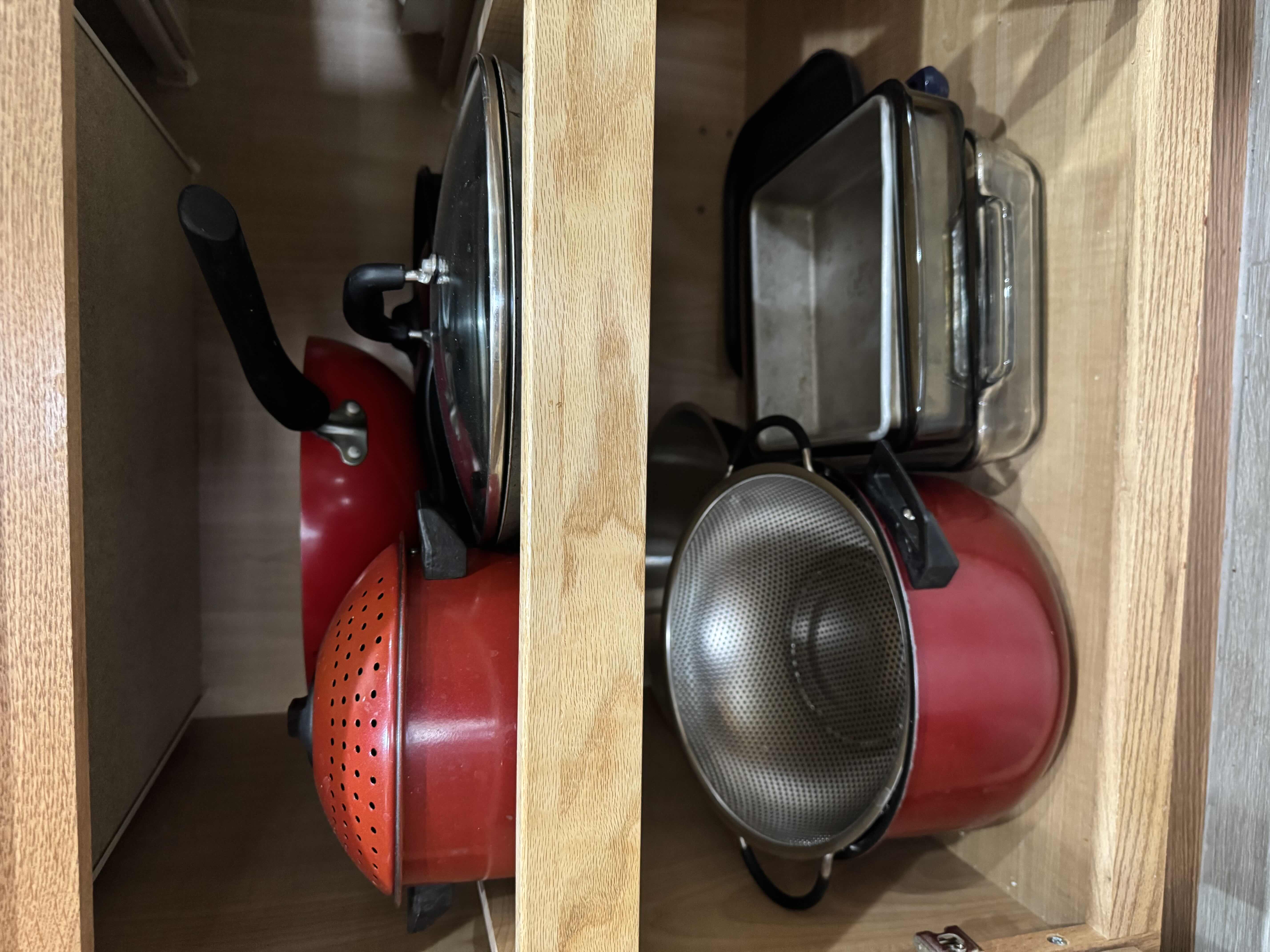 Photo 1 of CONTENTS OF KITCHEN CABINET, POTS AND PANS.