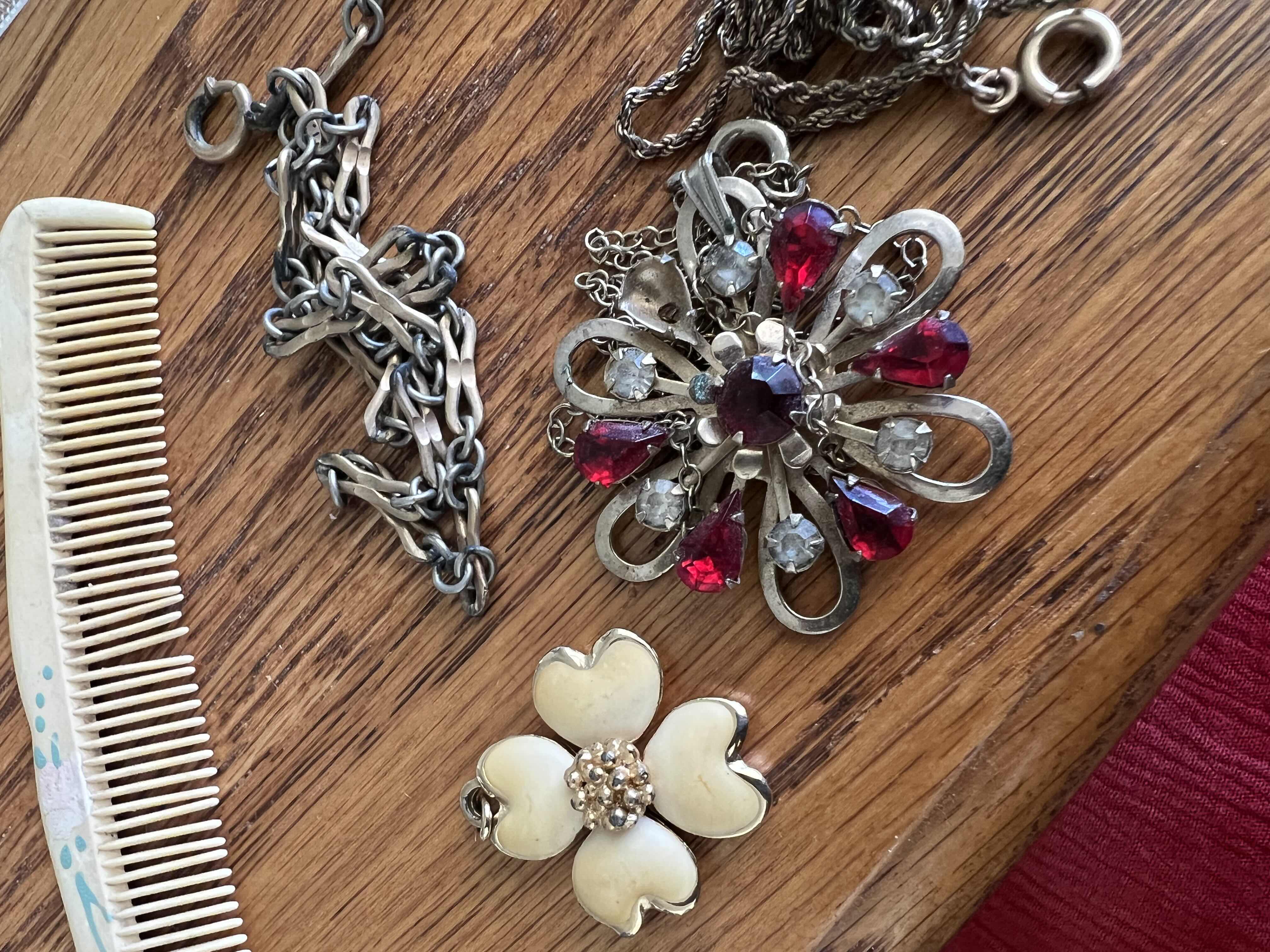 Photo 1 of LOT INCLUDING VINTAGE NECKLACES, PENDANTS, AND BAKELITE COMB EMBELLISHED WITH FLOWERS