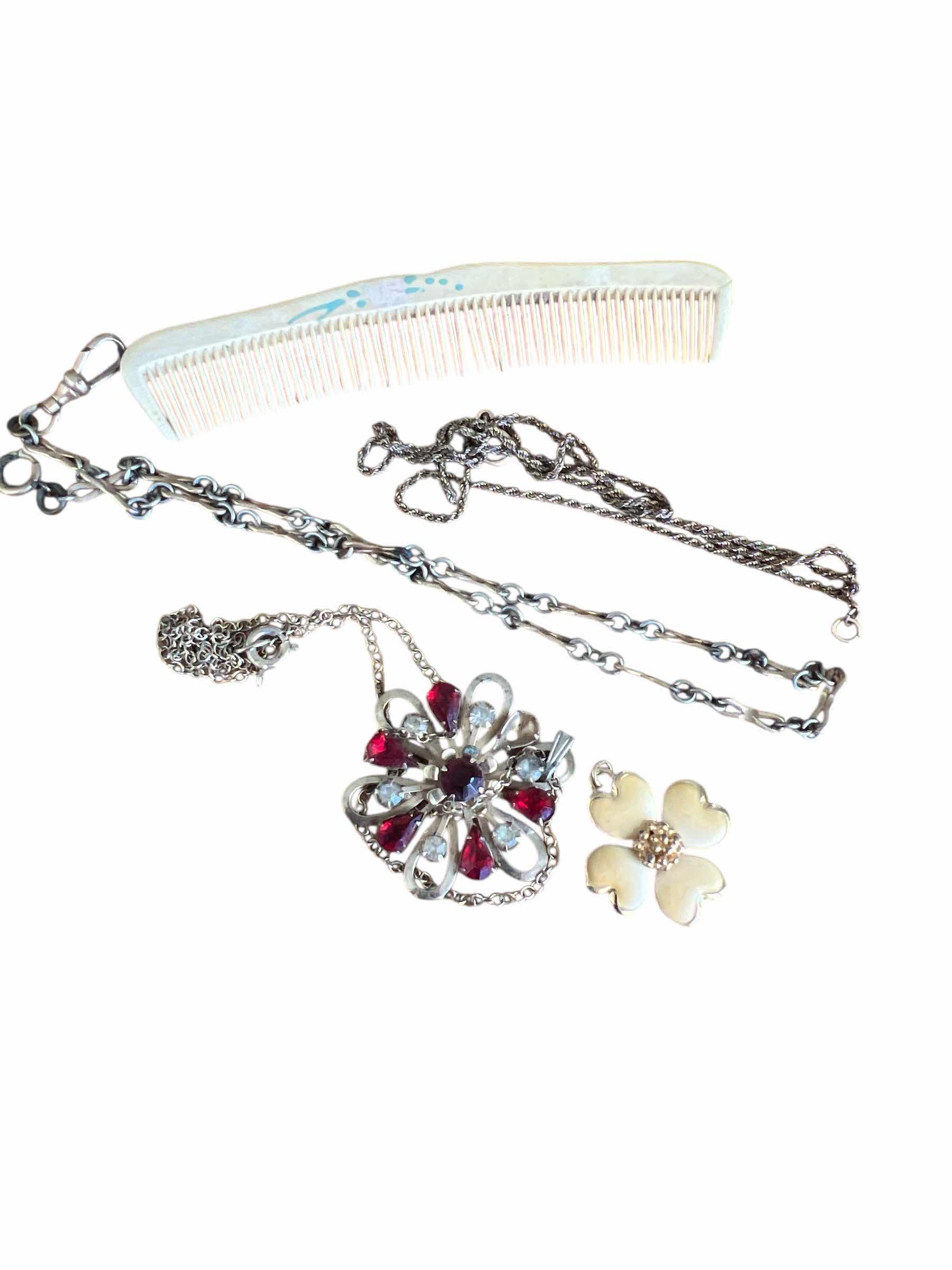 Photo 1 of LOT INCLUDING VINTAGE NECKLACES, PENDANTS, AND BAKELITE COMB EMBELLISHED WITH FLOWERS