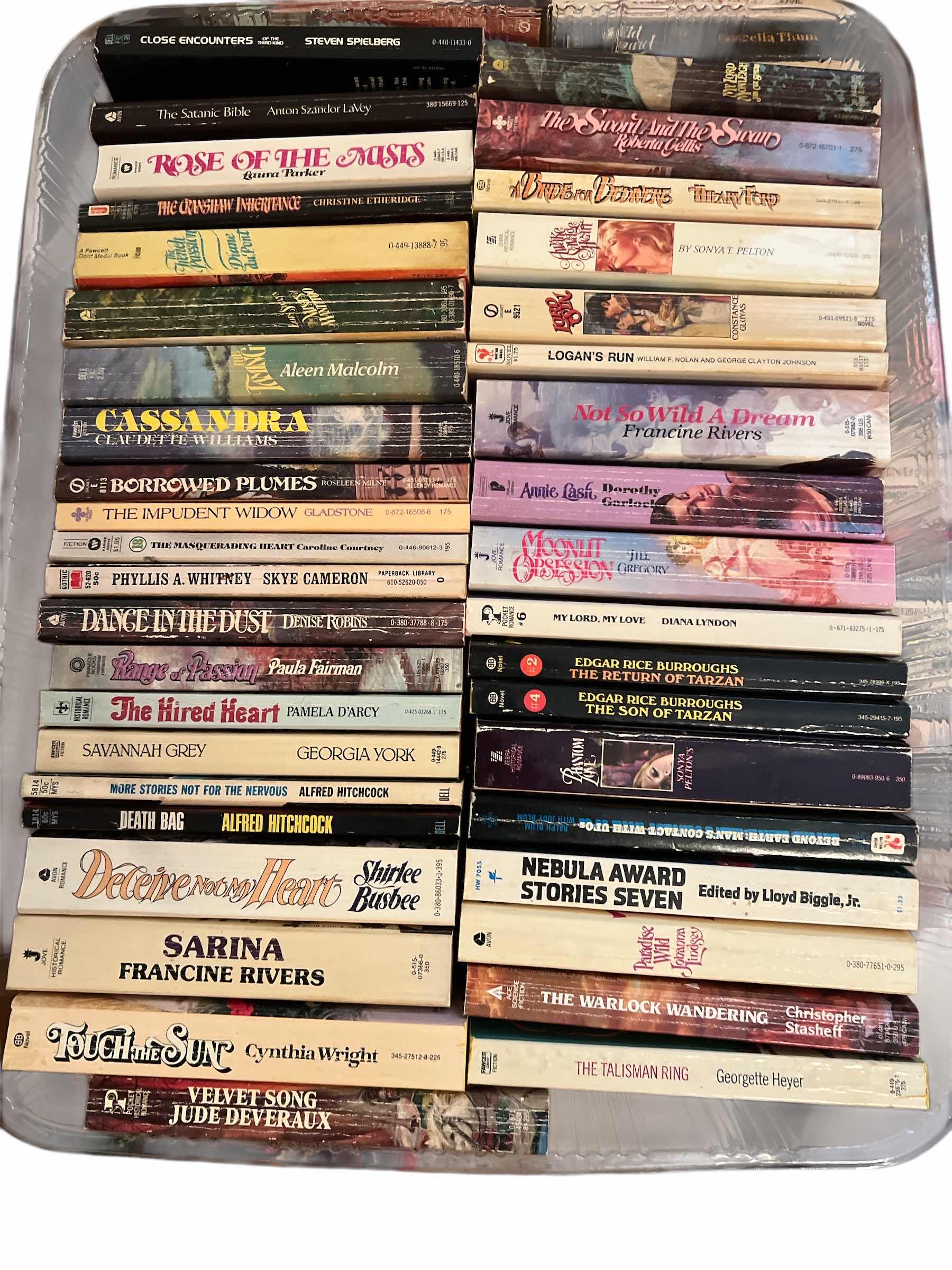 Photo 1 of PLASTIC TRAY OF PAPERBACK BOOKS AND MORE