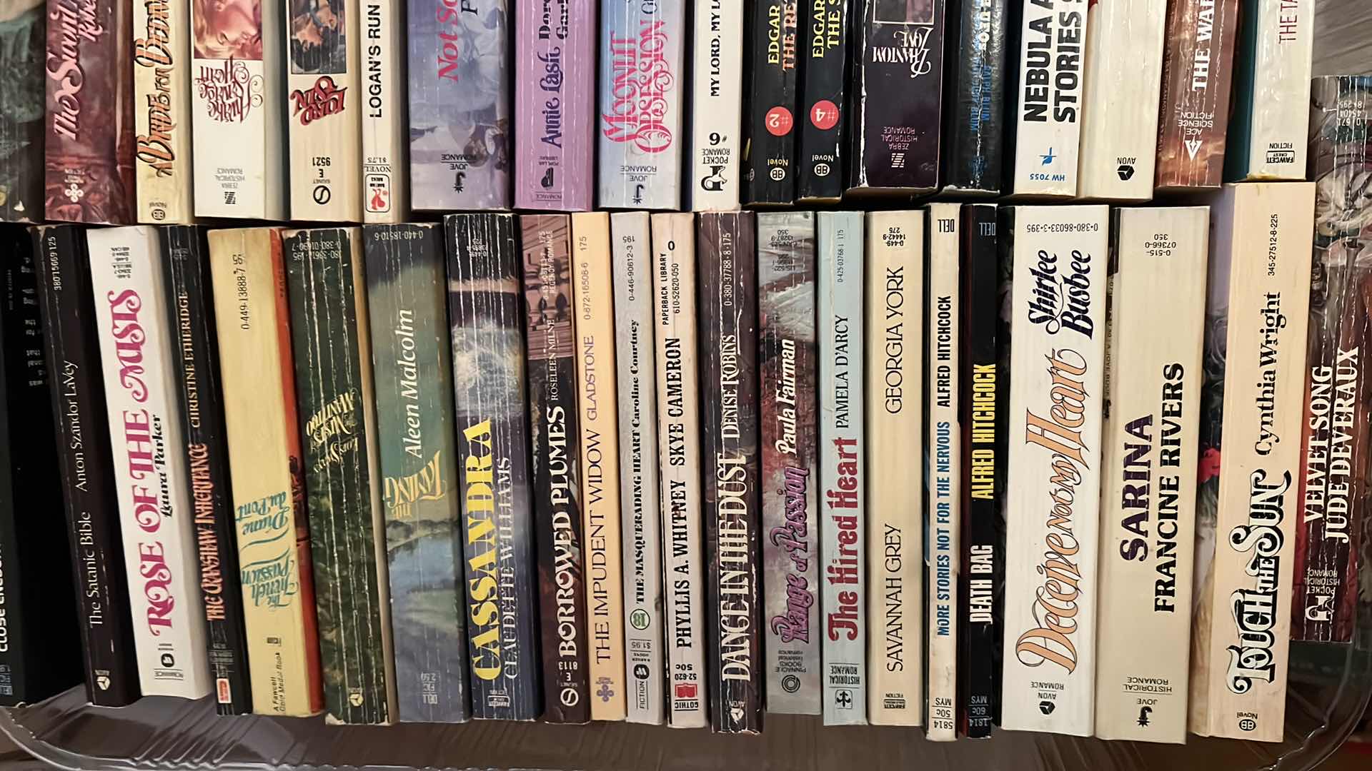 Photo 1 of PLASTIC TRAY OF PAPERBACK BOOKS AND MORE