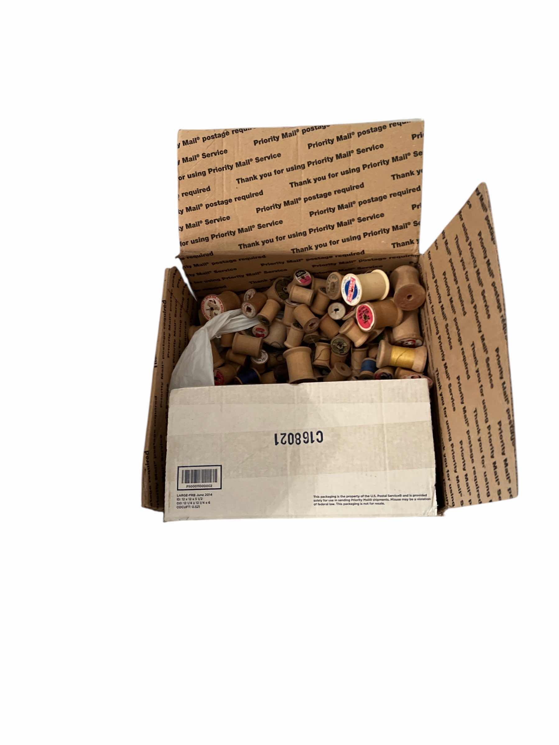 Photo 1 of BOX OF ANTIQUE WOODEN THREAD SPOOLS