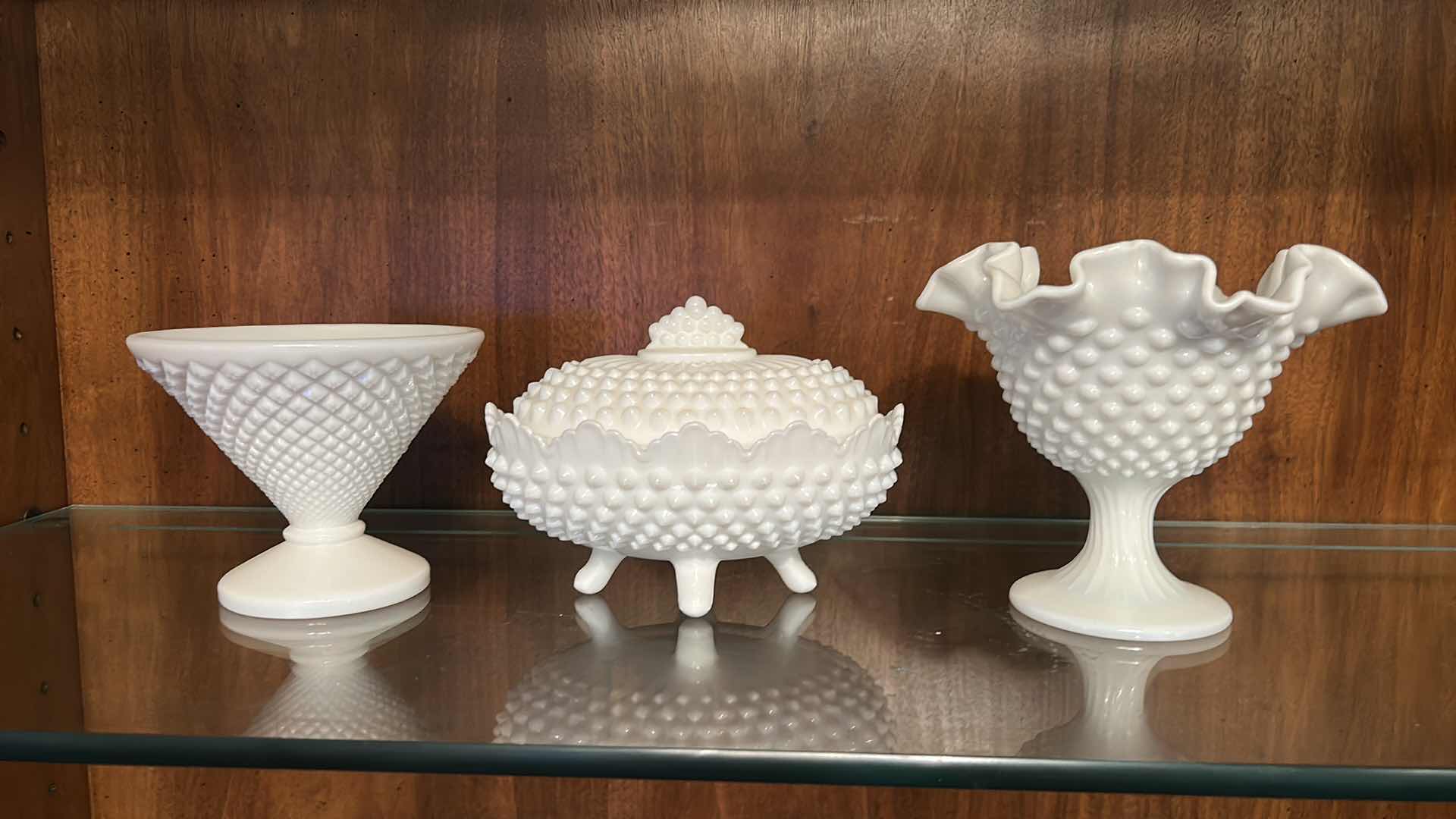 Photo 1 of 3 VINTAGE MILK GLASS PIECES -COMMONLY IDENTIFIED AS FENTON HOBNAIL. COVERED CANDY DISH, A RUFFLED VASE, AND A FOOTED COMPOTE BOWL, ALL SHOWCASING THE SIGNATURE RAISED DOT PATTERN.