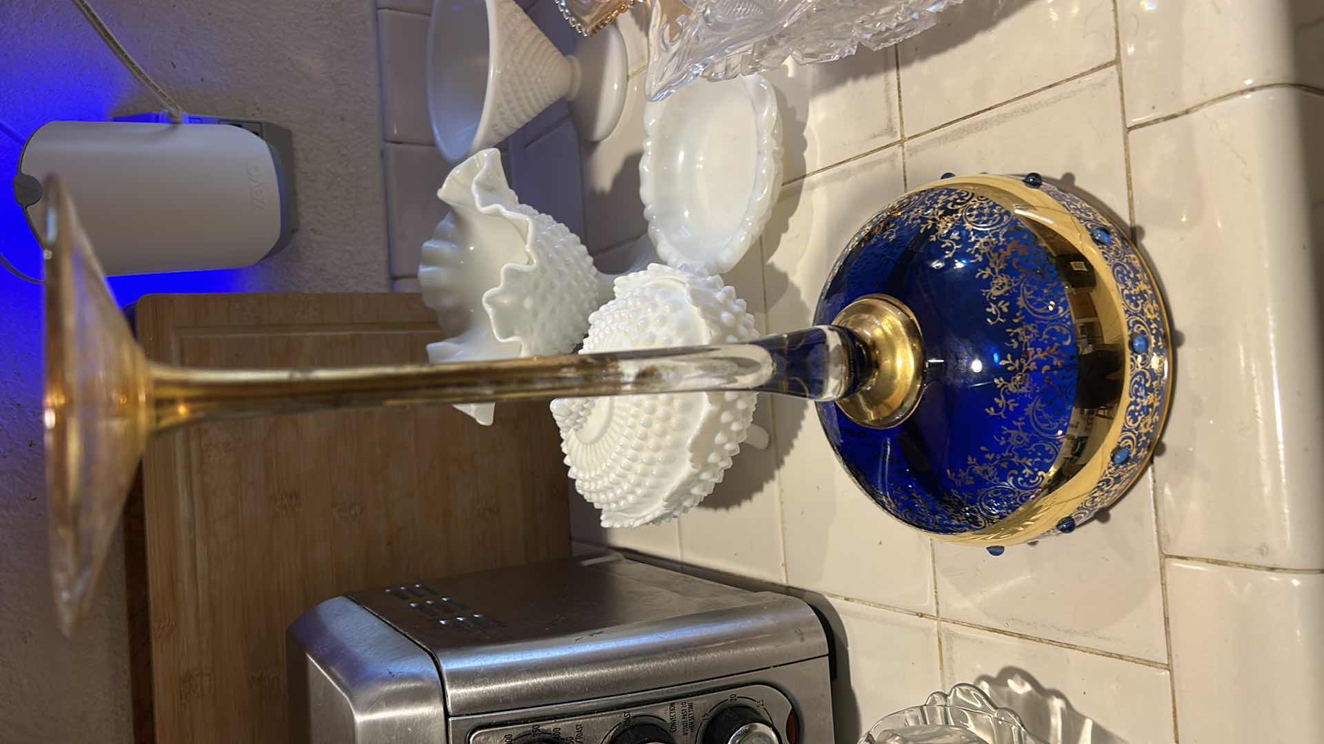 Photo 1 of 2 VINTAGE BOHEMIAN-STYLE COBALT AND GILT ART GLASS PEDESTAL COMPOTE / GOBLET, FEATURING HEAVY GOLD ENCRUSTED FLORAL DECORATION WITH COBALT BLUE JEWELED CABOCHON ACCENTS, CLEAR STEM, AND GILT FOOT, APPROX. H13” & BOHEMIAN CZECH COBALT BLUE GLASS BOWL,