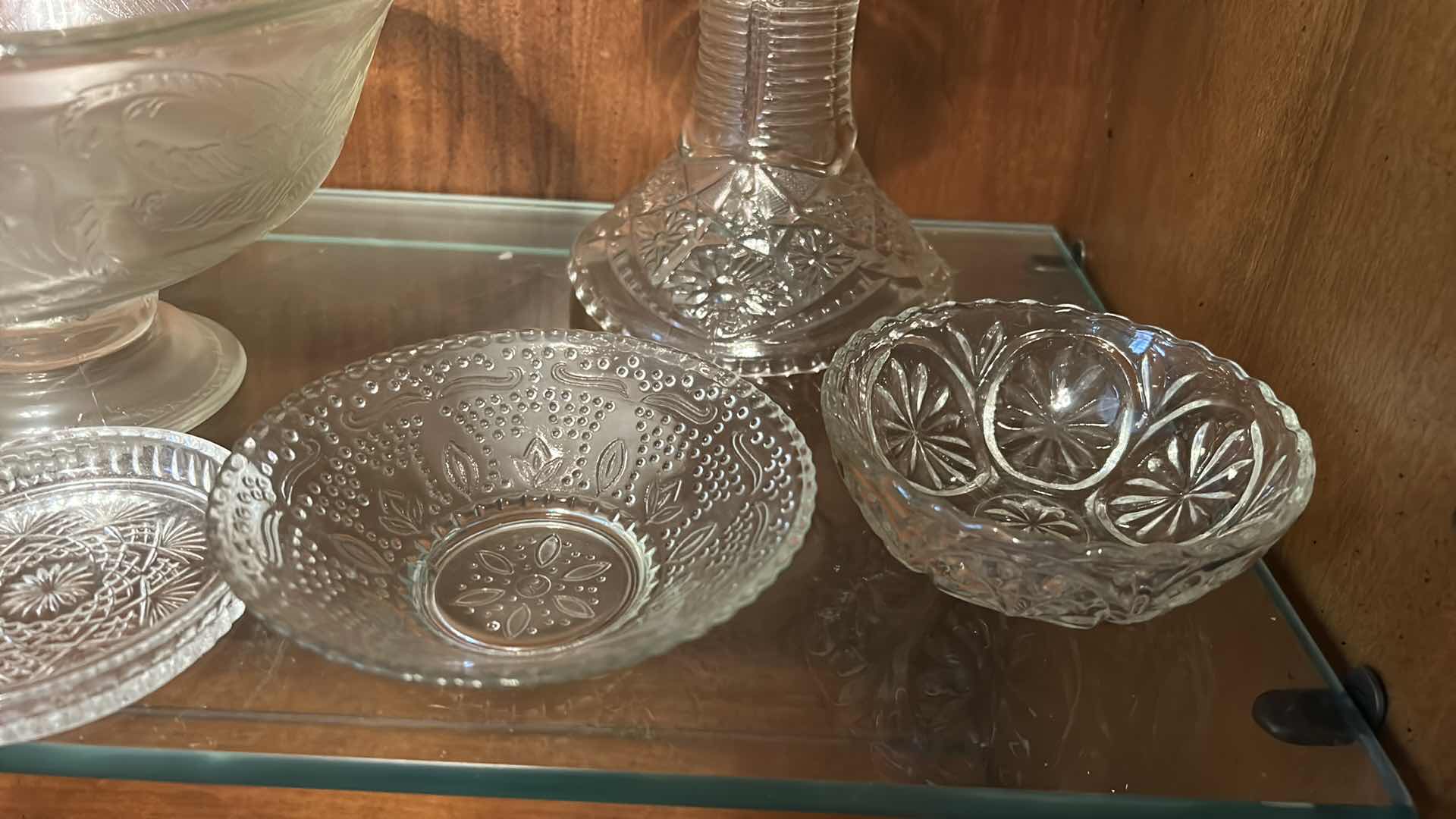 Photo 1 of COLLECTION OF VINTAGE GLASSWARE, FEATURING VARIOUS CLEAR PRESSED GLASS ITEMS SUCH AS A CENTRAL PEDESTAL PUNCH BOWL, SMALLER FOOTED COMPOTES, SERVING BOWLS, AND MUG