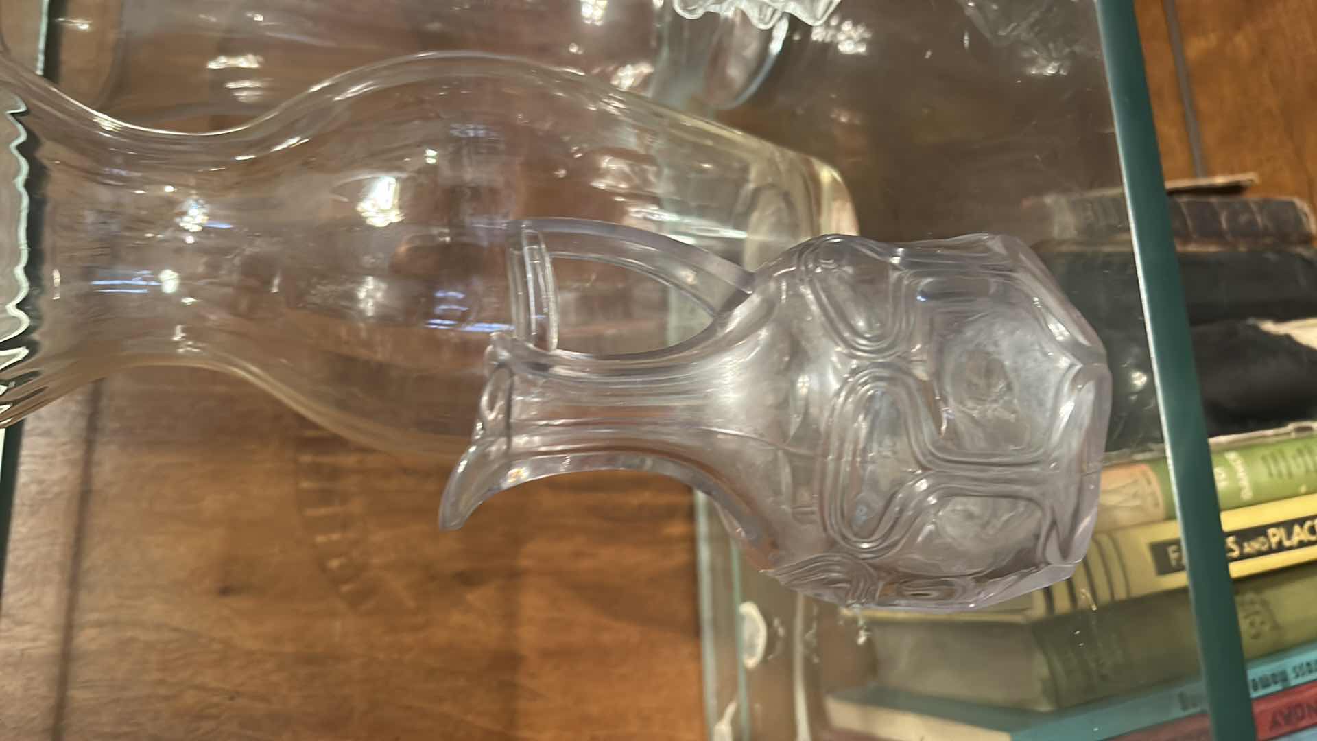 Photo 1 of 12 GLASS PIECES- VINTAGE GLASSWARE INCLUDES A VARIETY OF CLEAR GLASS LIDDED JARS, VASES, AND BOTTLES FROM THE 1950S TO THE 1970S.