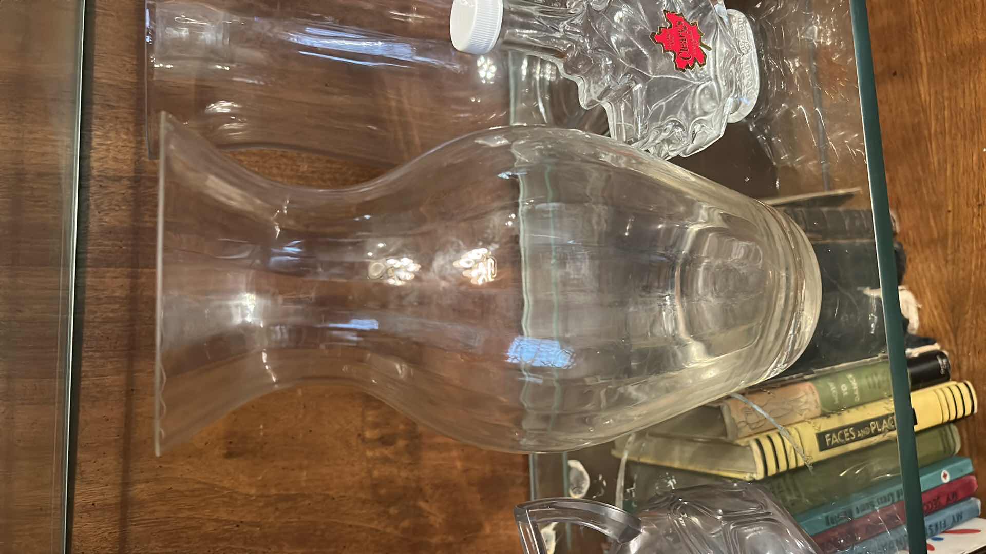 Photo 1 of 12 GLASS PIECES- VINTAGE GLASSWARE INCLUDES A VARIETY OF CLEAR GLASS LIDDED JARS, VASES, AND BOTTLES FROM THE 1950S TO THE 1970S.