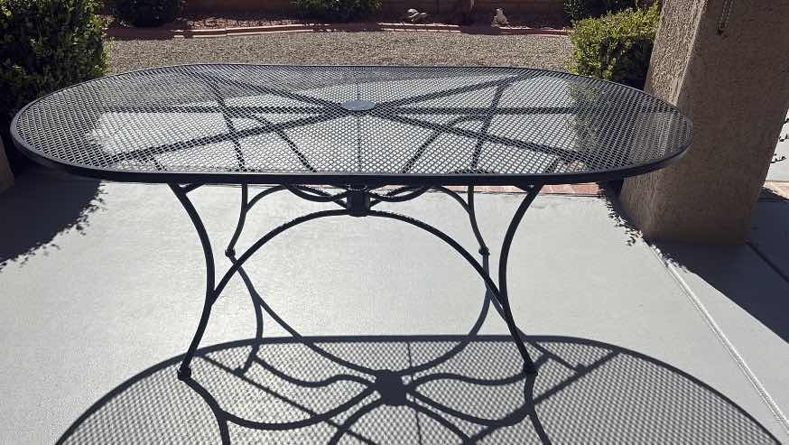 Photo 1 of HAMPTON BAY NANTUCKET BLACK METAL OUTDOOR PATIO TABLE E/DURABLE MESH TOP & CENTRAL UMBRELLA HOLE 76”X42”X28.5”