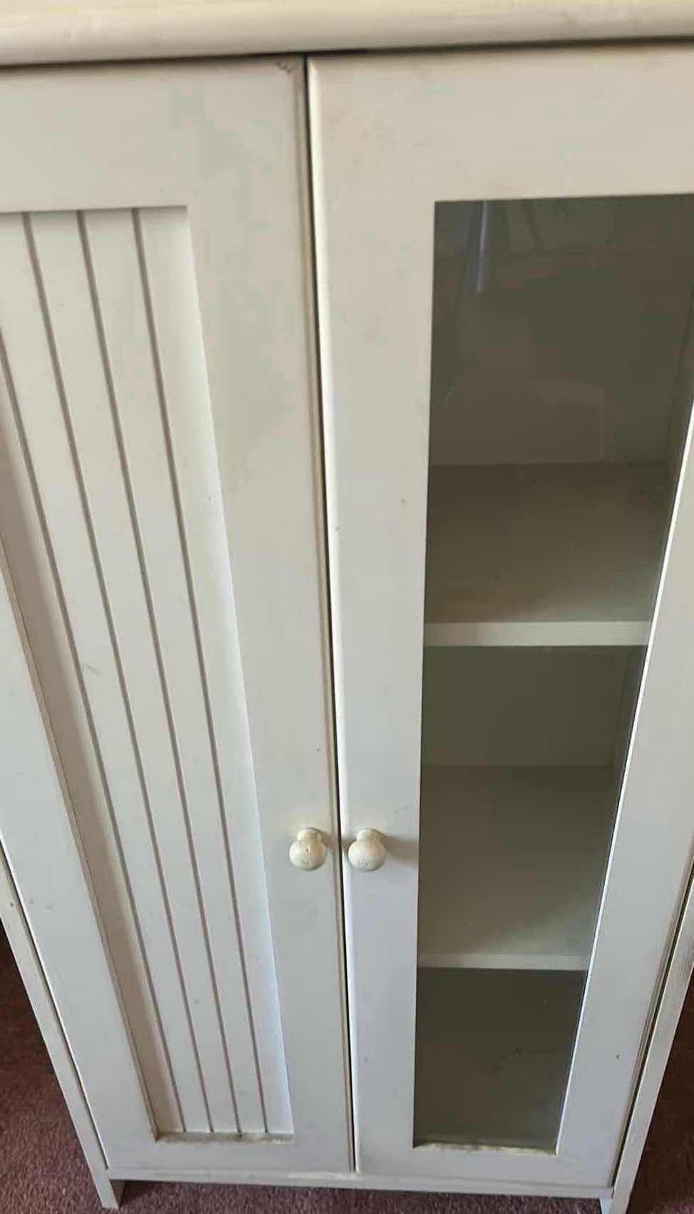 Photo 1 of WHITE FREESTANDING STORAGE CABINET W GLASS PANELED DOOR & SLATTED DOOR 19" X 10" H 35"