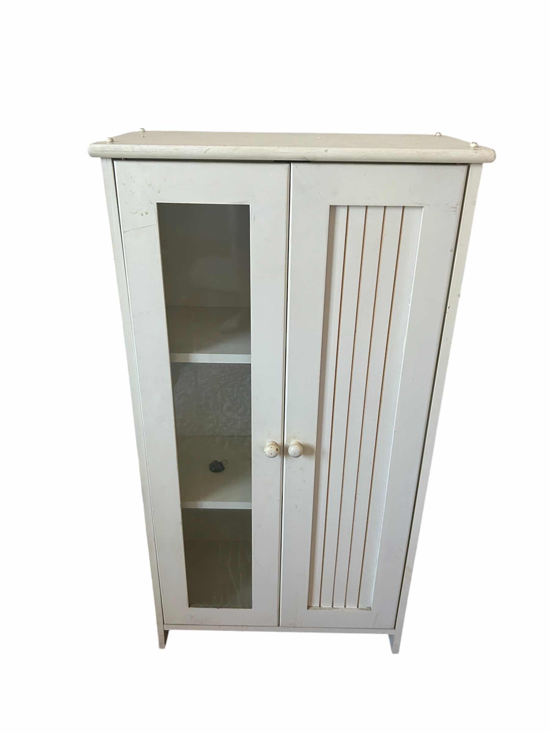 Photo 1 of WHITE FREESTANDING STORAGE CABINET W GLASS PANELED DOOR & SLATTED DOOR 19" X 10" H 35"