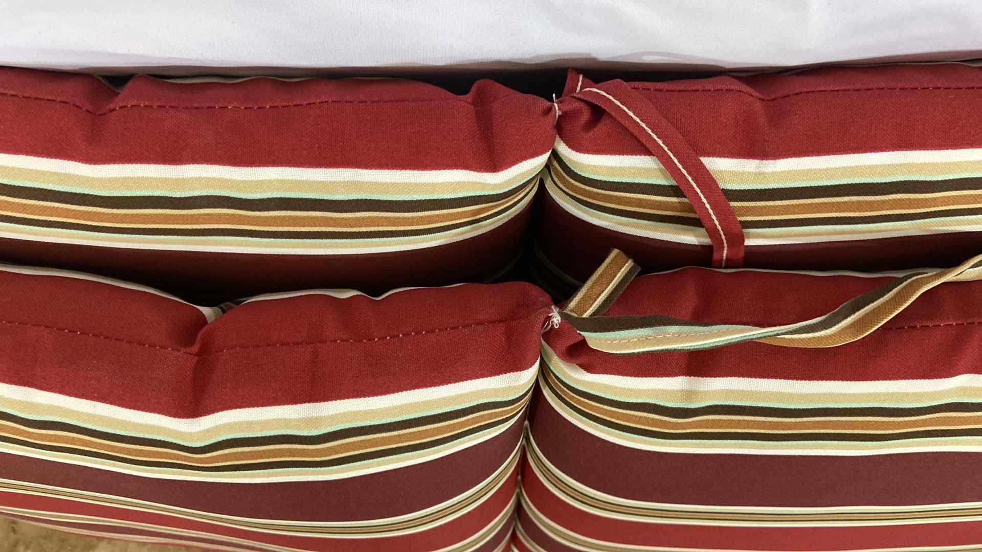 Photo 1 of 2-PATIO CHAIRS SEAT CUSHIONS 36” X 19” POLYESTER MATERIAL