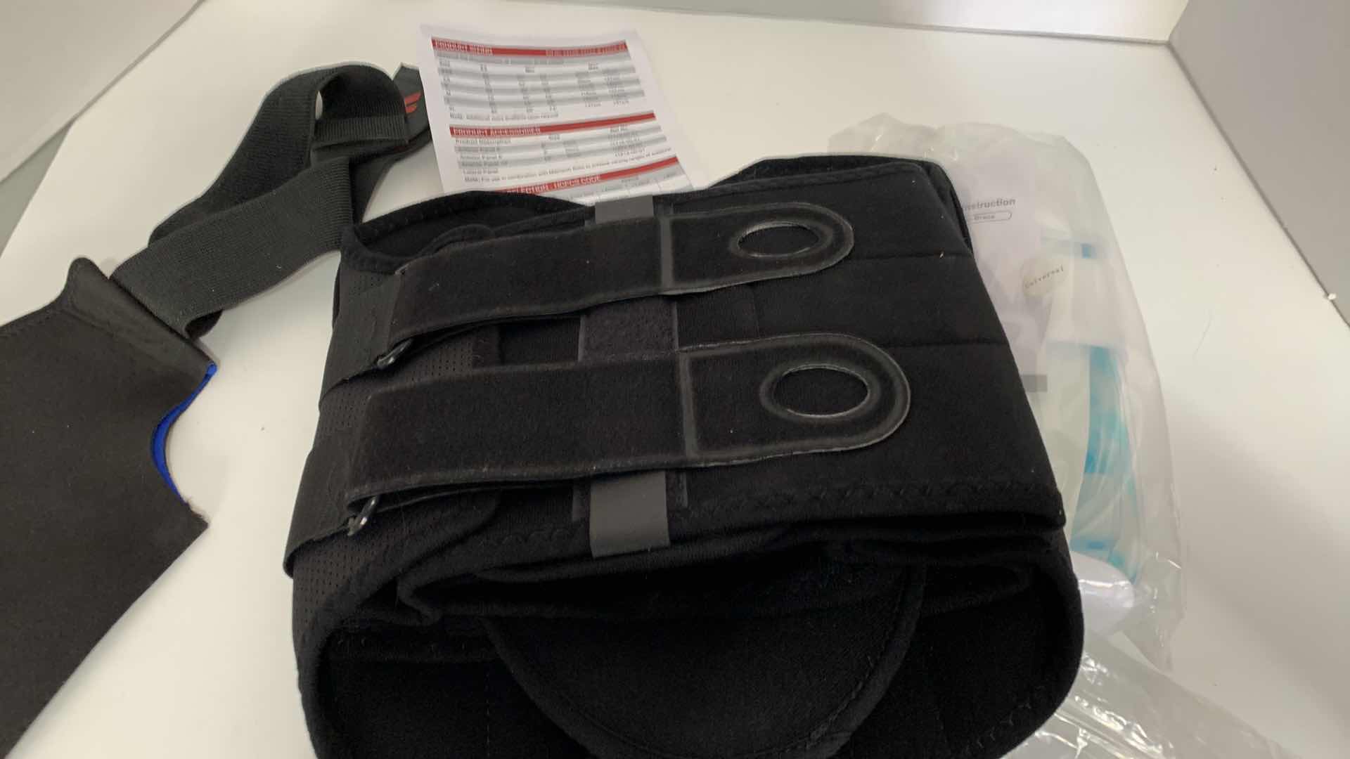 Photo 1 of 3-ANKLE BRACES AND A BACK BRACE