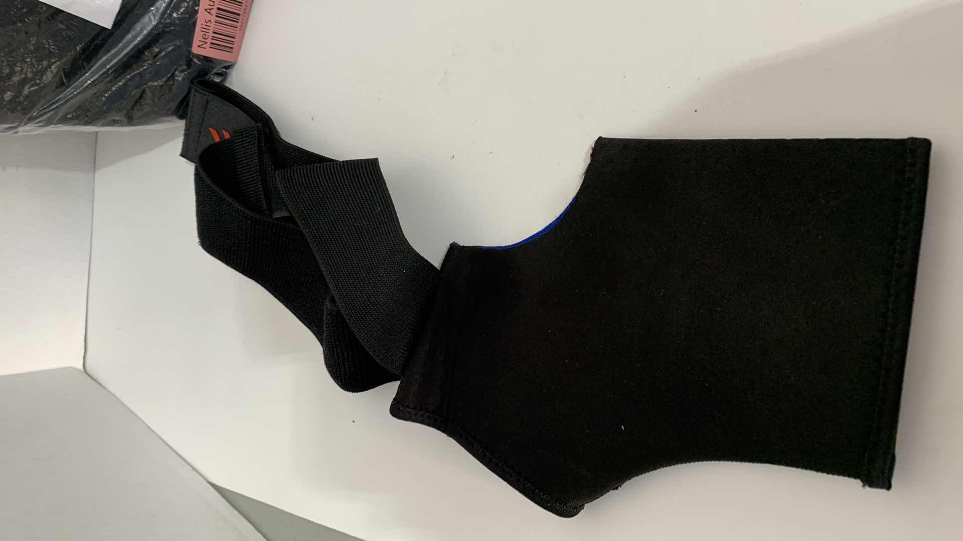 Photo 1 of 3-ANKLE BRACES AND A BACK BRACE