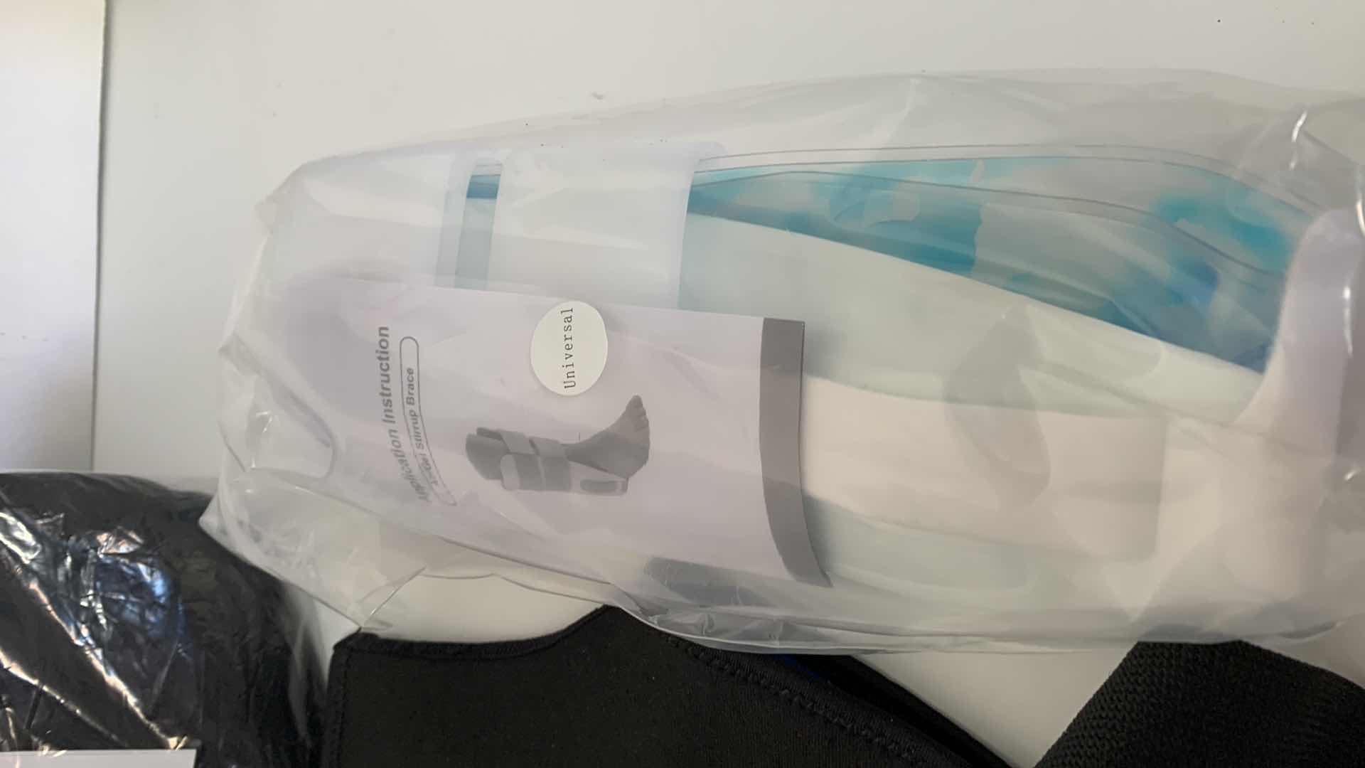 Photo 1 of 3-ANKLE BRACES AND A BACK BRACE