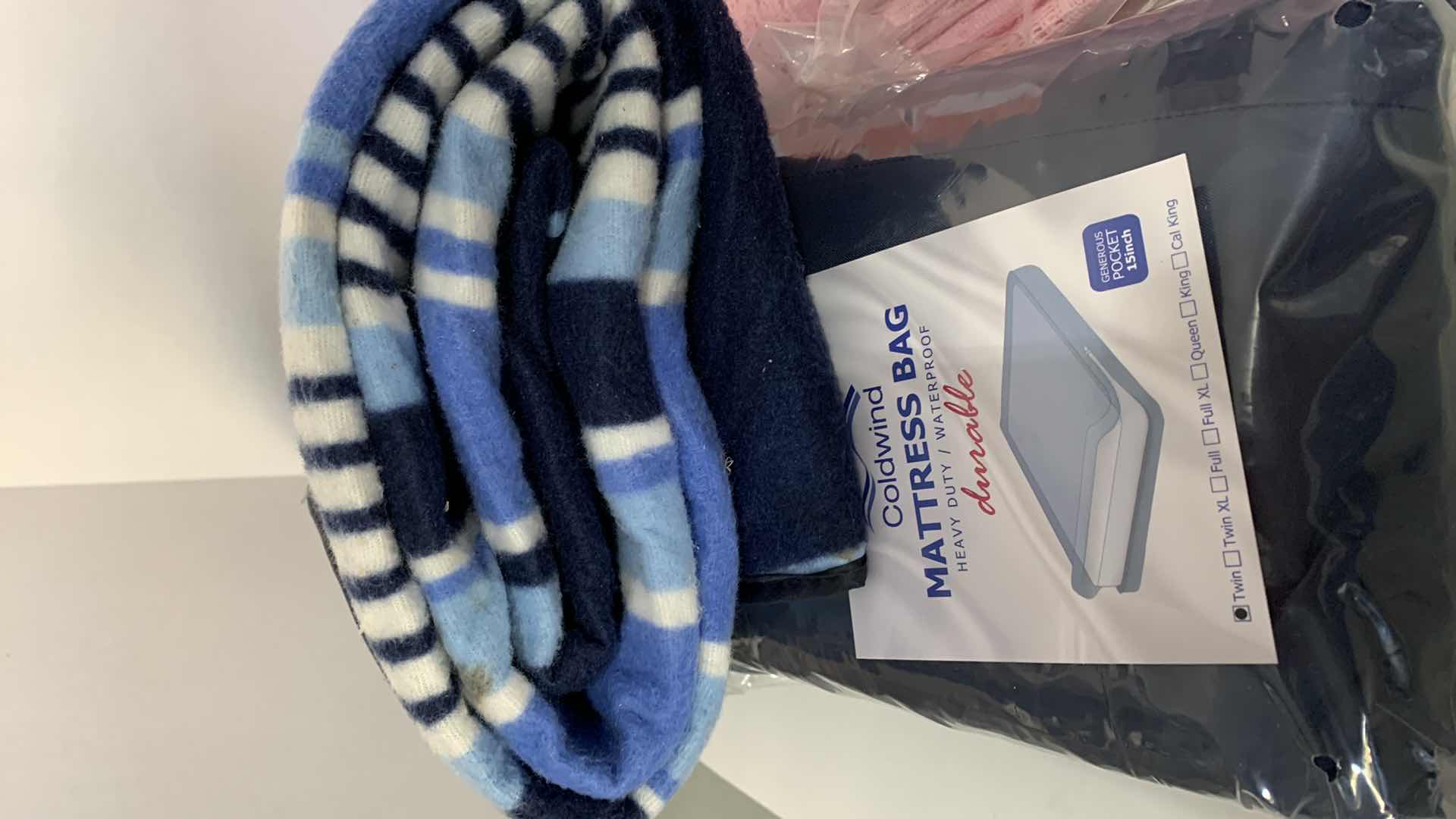 Photo 1 of 2-BLANKETS, A TWIN MATTRESS BAG , PILLOW AND A QUEEN BLANKET