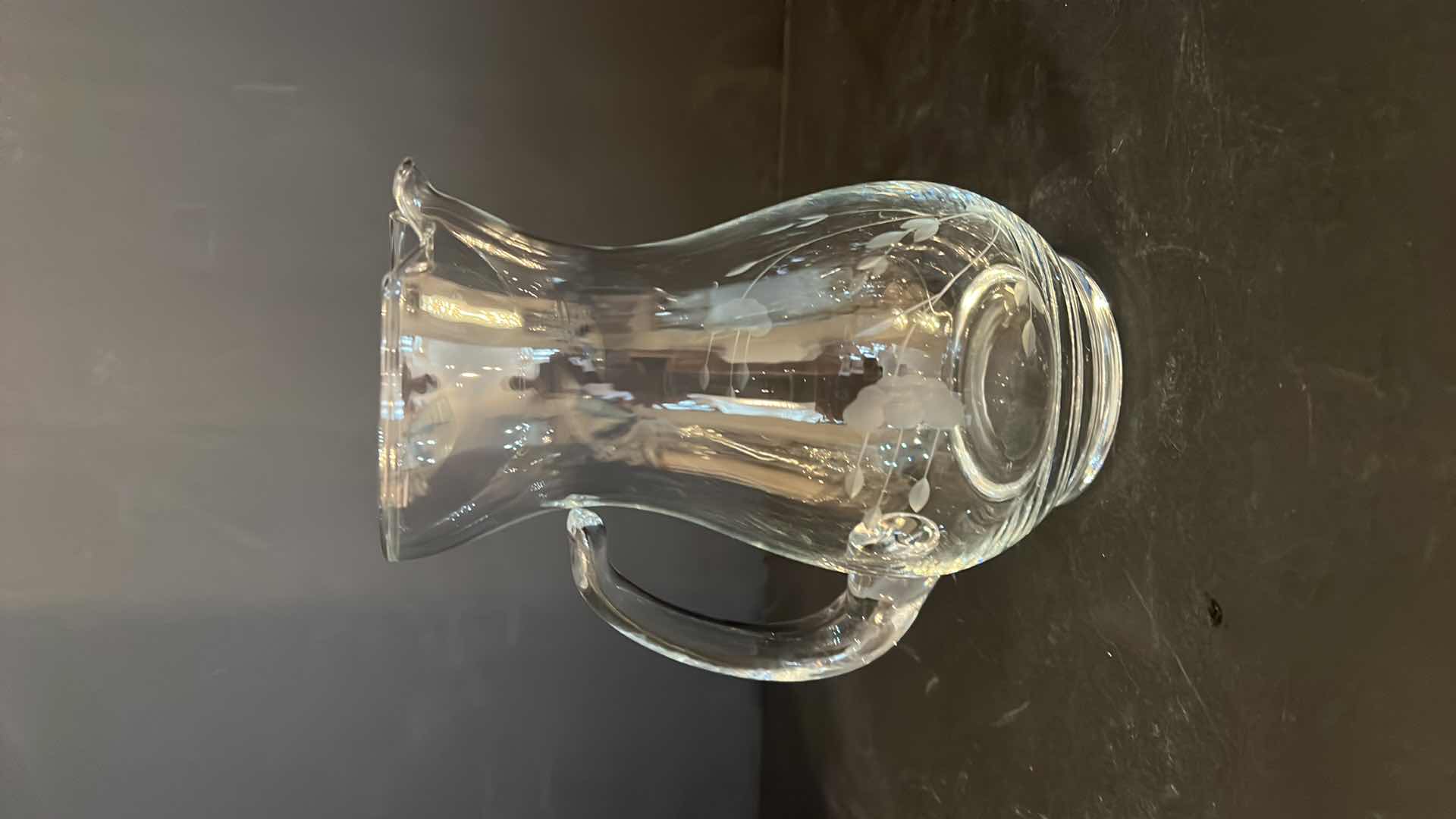 Photo 1 of VINTAGE-6.75”H FLORAL ETCHED GLASS PITCHER.