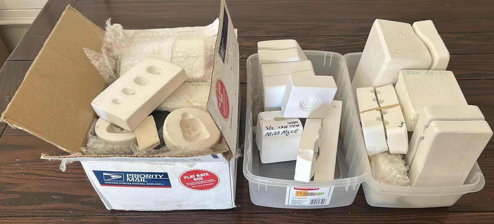 Photo 1 of 3- CONTAINERS OF DOLL MOLDS